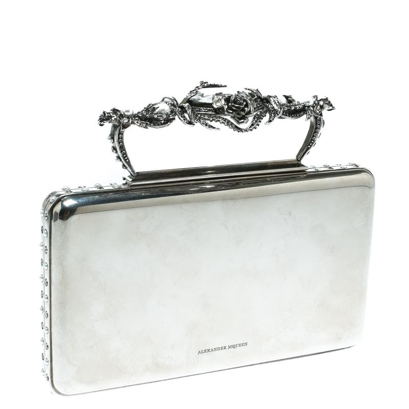 This awe-inspiring Ottone clutch from Alexander McQueen is just what you need to grab all the attention at those soirees and parties. We love the astoundingly designed top handle that makes this piece an investment-worthy article. Crafted from