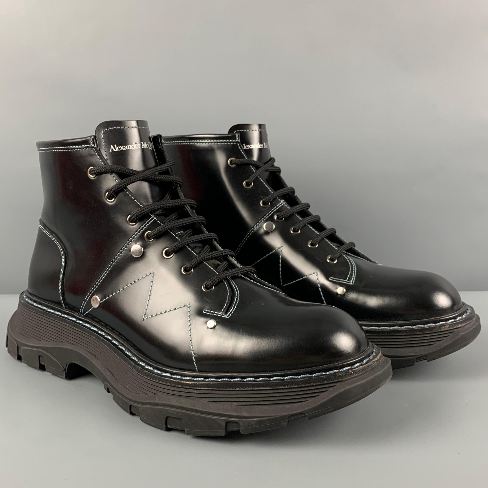 ALEXANDER McQUEEN boots comes in a black leather featuring a high top style, contrast stitching, chunky rubber sole, and a lace up closure. Includes box. Made in Italy. 

Excellent Pre-Owned Condition.
Marked: 604253 44 D
Original Retail Price: