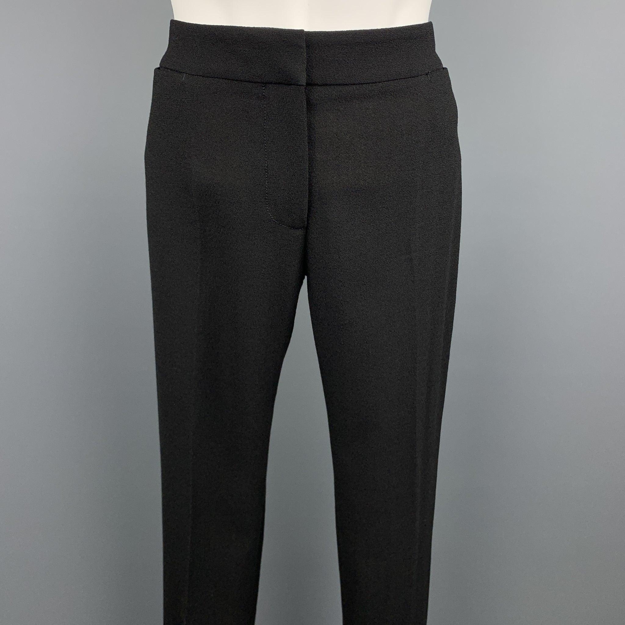 ALEXANDER McQUEEN dress pants comes in a black crepe featuring a straight leg, front tab, and a zip fly closure. Made in Italy.Excellent
Pre-Owned Condition. 

Marked:   IT 38 

Measurements: 
  Waist: 28 inches 
Rise: 7 inches 
Inseam: 30 inches 
 