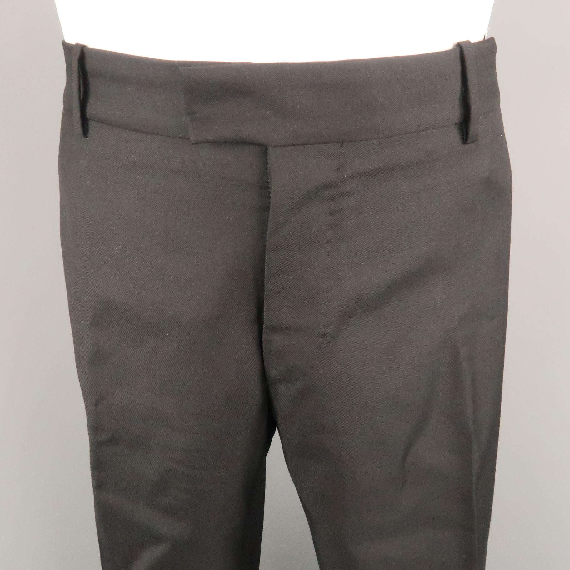 ALEXANDER MCQUEEN dress pant comes in a black wool featuring a flat front style. Made in Italy.
 
Excellent Pre-Owned Condition.
Marked: (No size)
 
Measurements:
 
Waist: 34 in.
Rise: 8 in.
Inseam: 32.5 in.