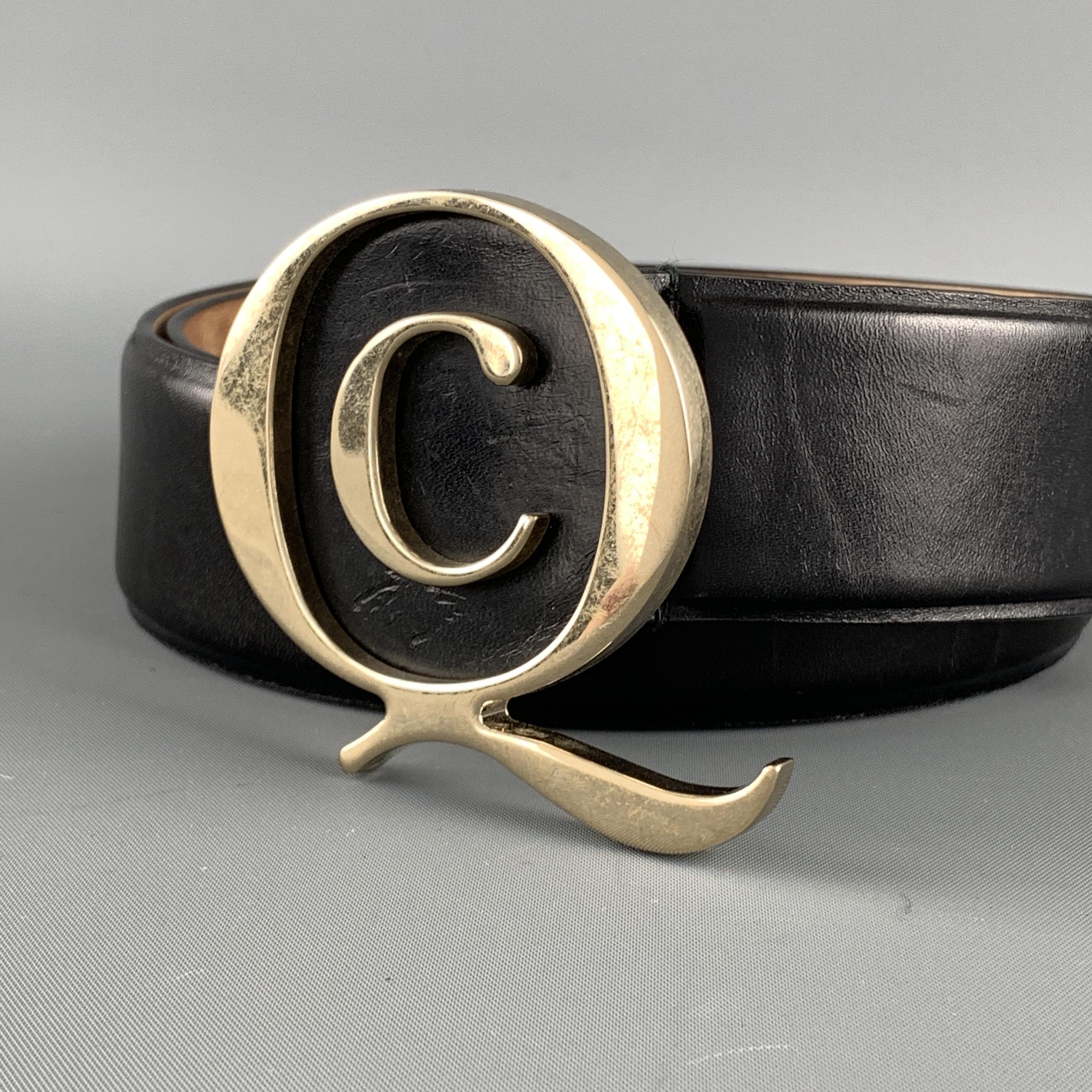 ALEXANDER MCQUEEN belt features a black leather strap with gold tone brass Q buckle. Made in Italy.

Very Good Pre-Owned Condition.
Marked: 85.34  196219.1766

Length: 39.5 in.
Width: 1.5 in.
Fits: 31-35 in.
Buckle: 6 x 7 cm.