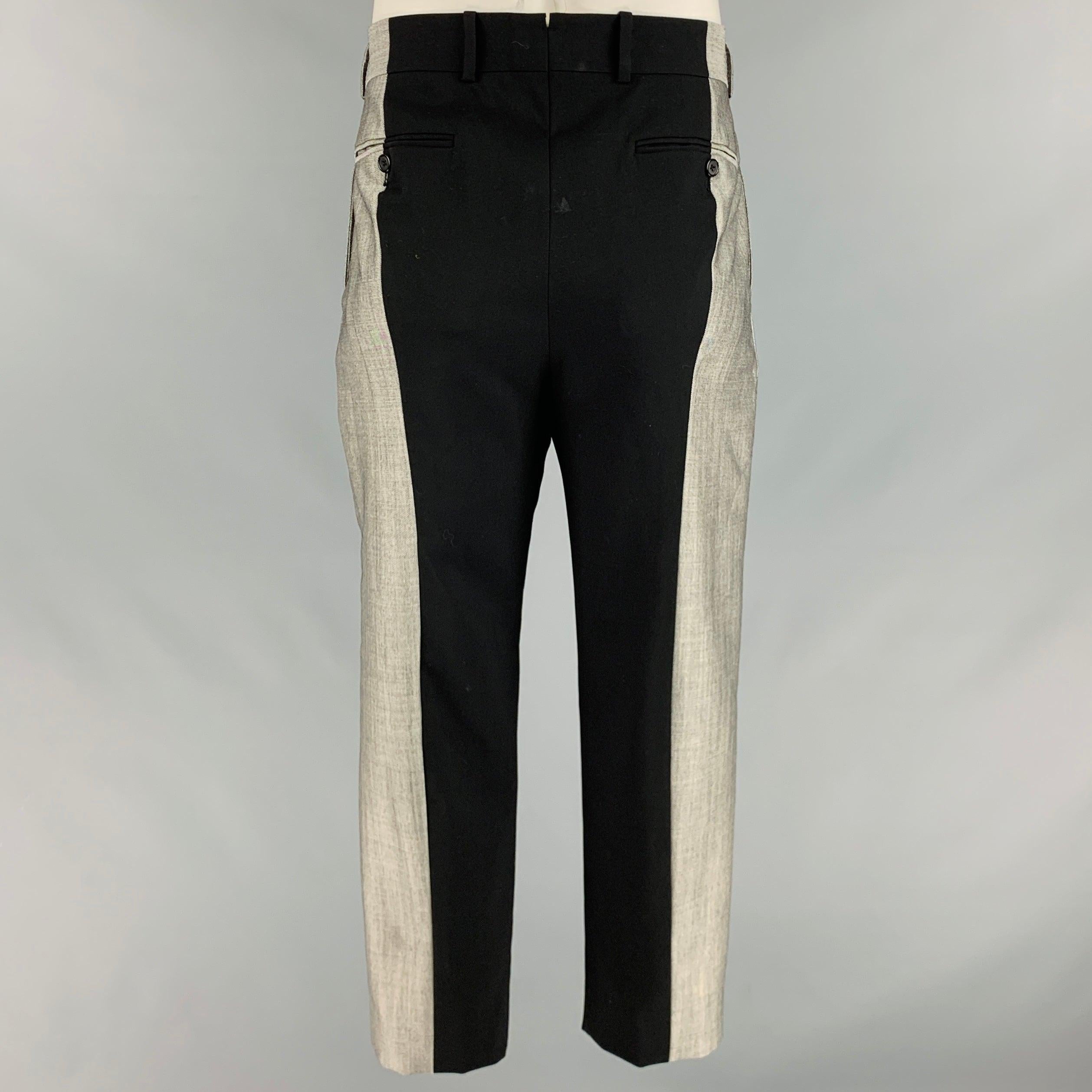 ALEXANDER MCQUEEN Size 38 Black Grey Two Tone Wool Flat Front Dress Pants In Good Condition For Sale In San Francisco, CA