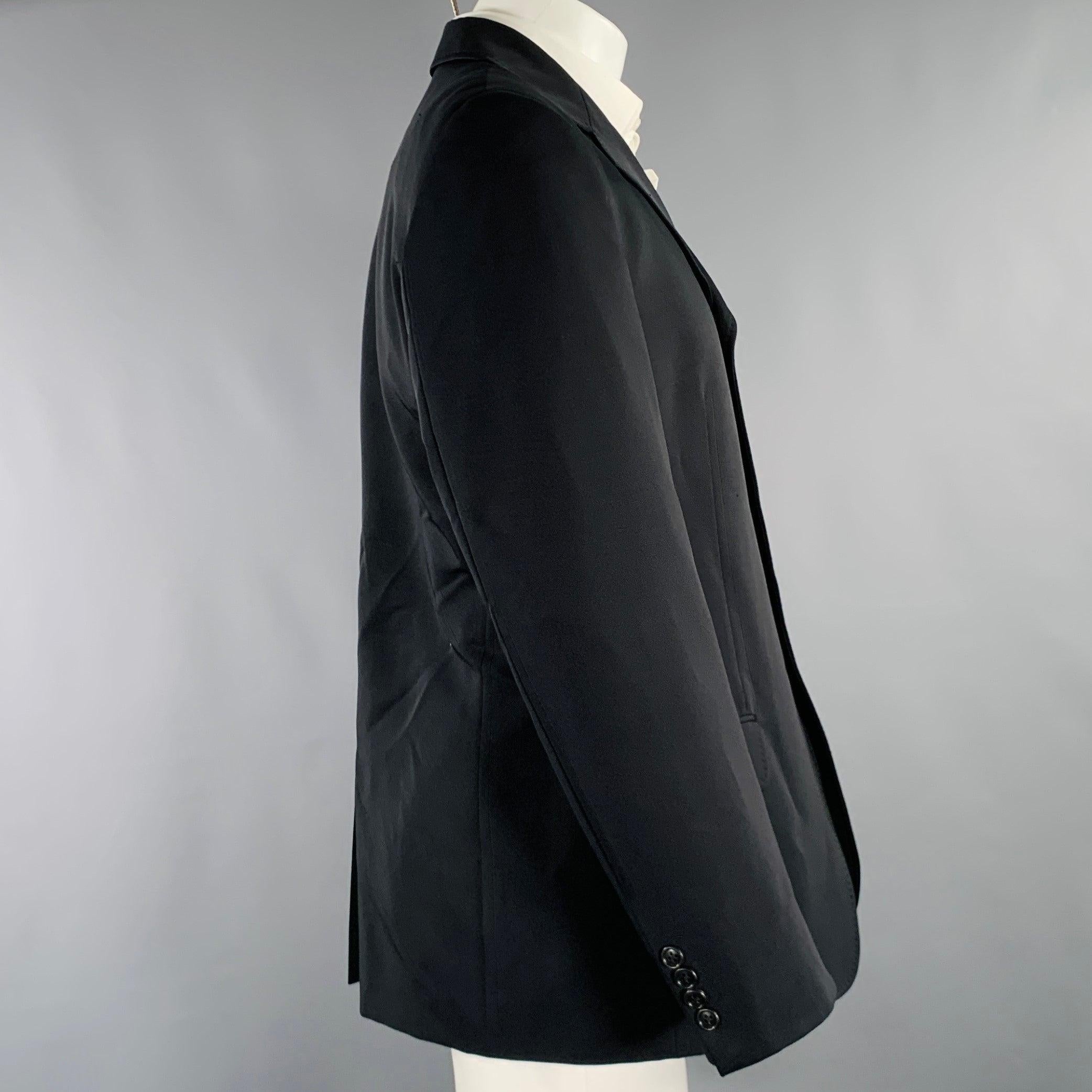 ALEXANDER MCQUEEN sport coat
in a
black polyester blend featuring a notch lapel, single vented back, and three button closure. Made in Italy.Excellent Pre-Owned Condition. 

Marked:   IT 48 

Measurements: 
 
Shoulder: 18 inches Chest: 38 inches