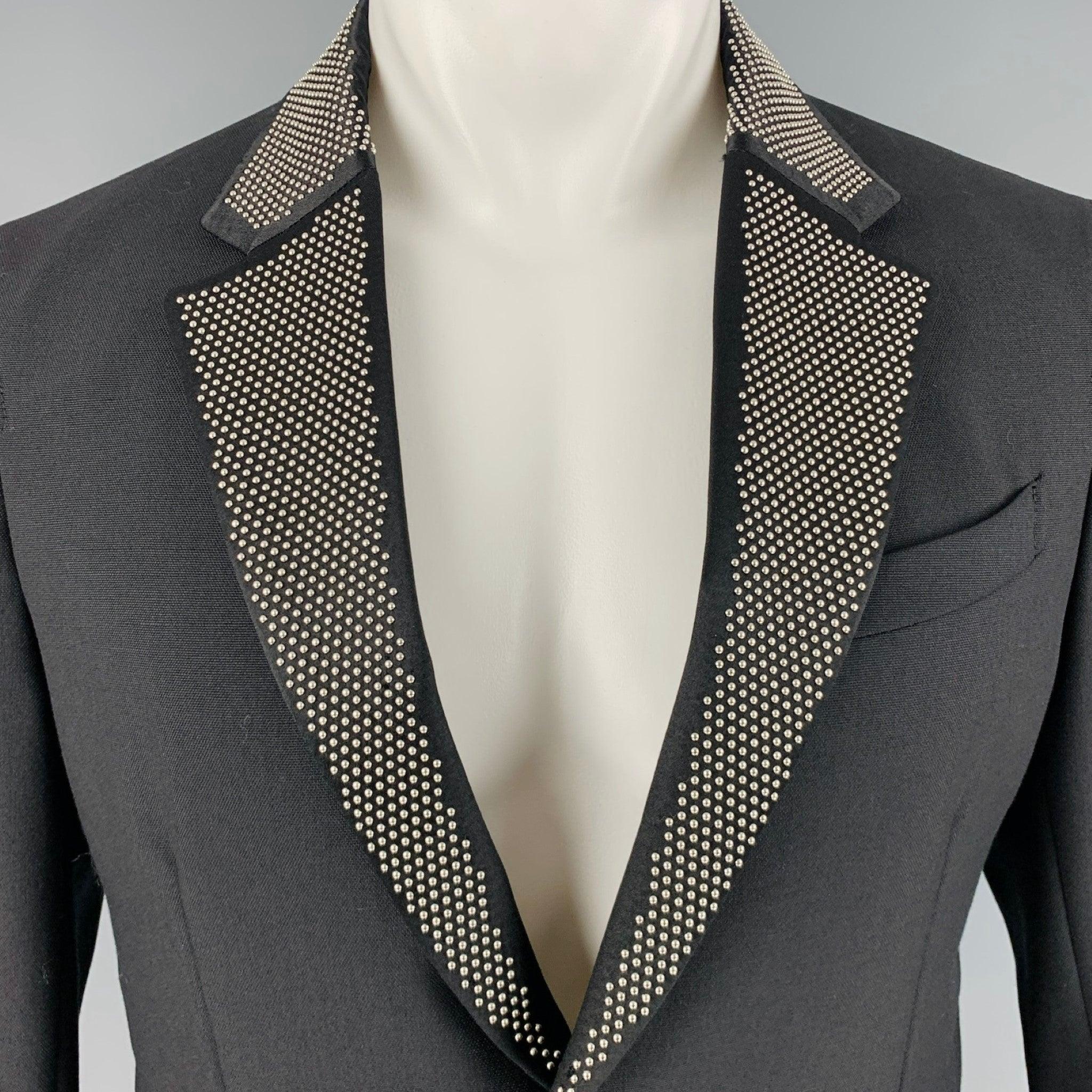 ALEXANDER MCQUEEN sport coat
in
a black wool mohair blend fabric featuring a studded notch lapel, single vented back, and double button closure. Made in Italy.Excellent Pre-Owned Condition. 

Marked:   48 

Measurements: 
 
Shoulder: 16.5 inches