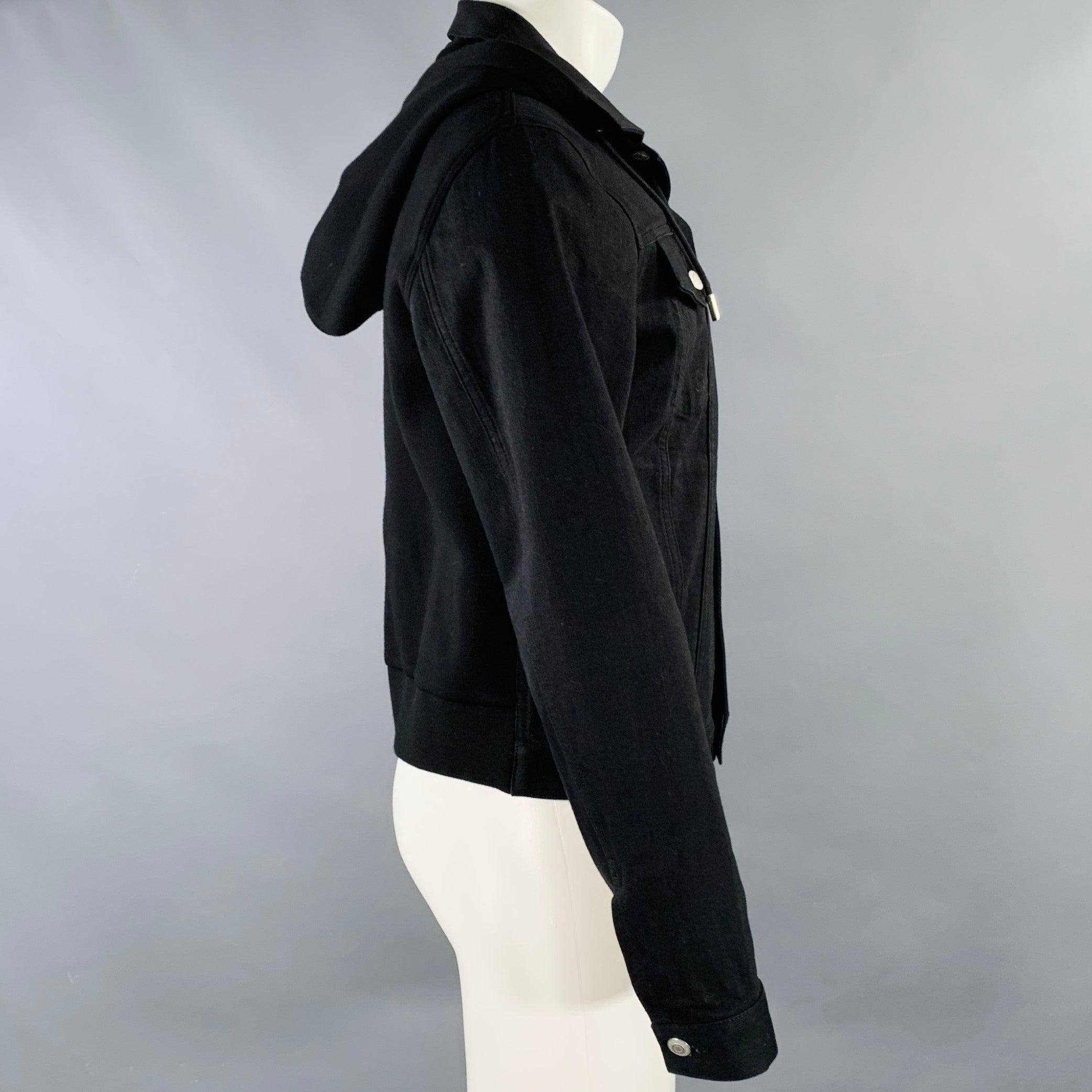 ALEXANDER MCQUEEN jacket
in a black cotton stretch blend denim twill featuring stretchy viscose hood and back, red embroidered accent on back, and button closure.Good Pre-Owned Condition. Hole in shoulder, as is. 

Marked:   IT 50 

Measurements: 
