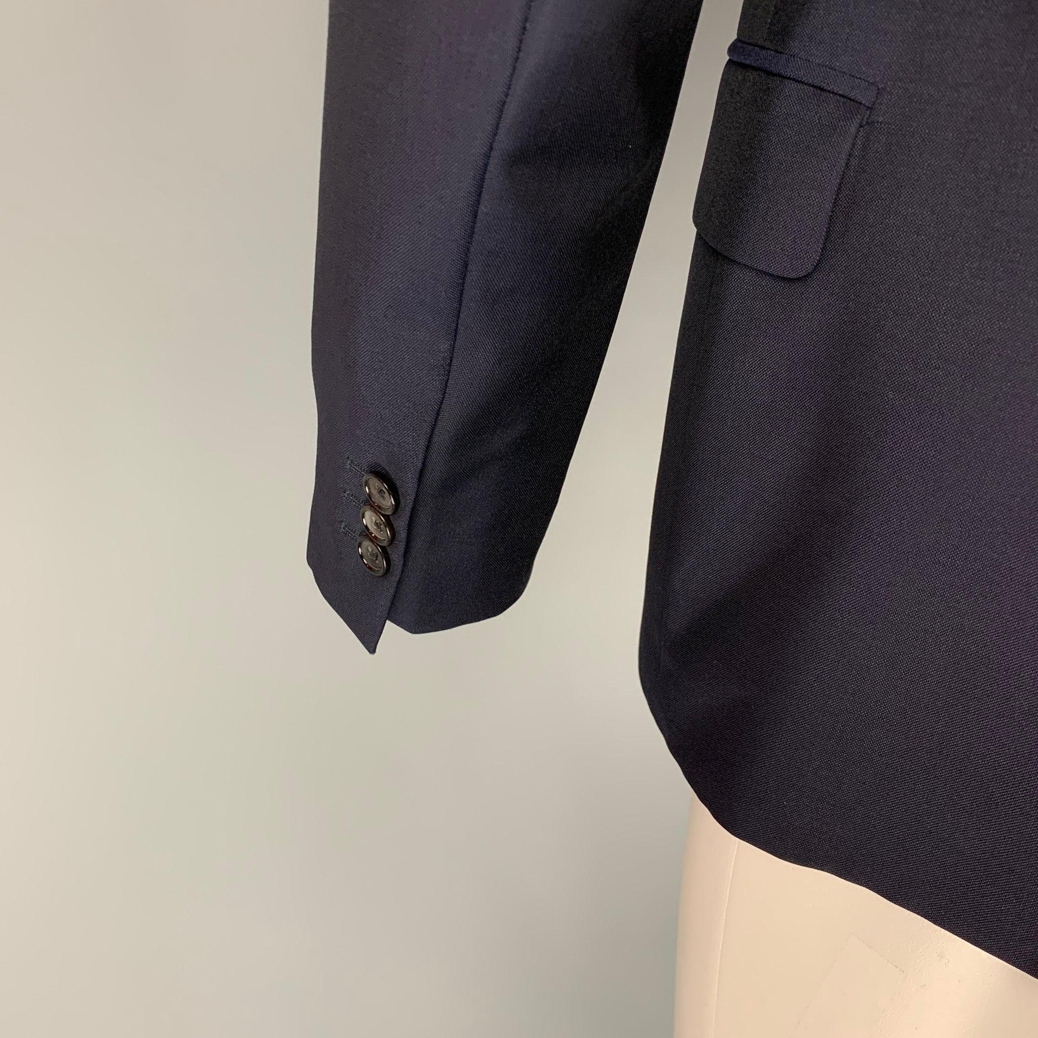ALEXANDER MCQUEEN - Manteau de sport en laine et mohair bleu marine à revers clouté, taille 42 Pour hommes en vente