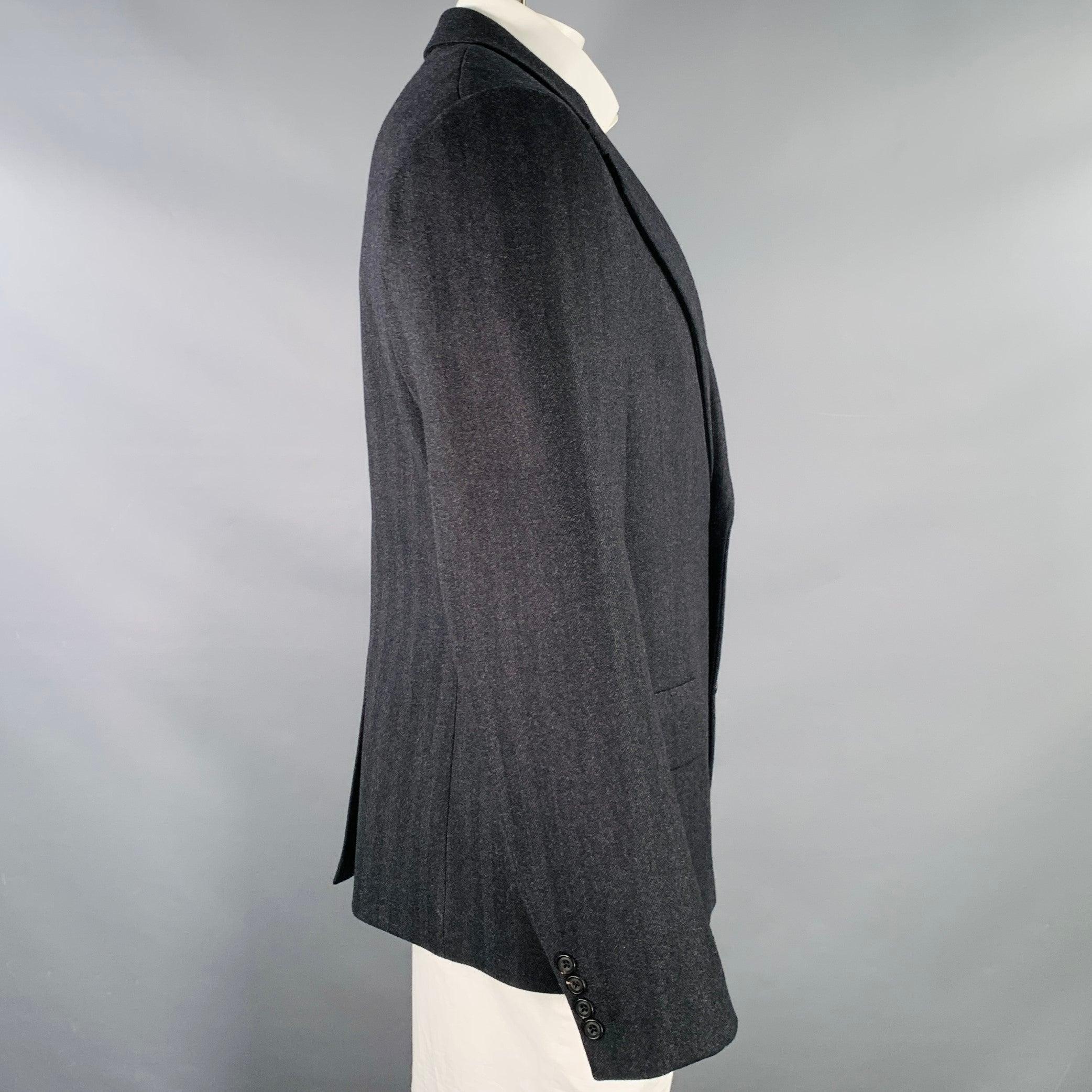 ALEXANDER MCQUEEN sport coat
in a black wool cashmere blend featuring a notch lapel, single vented back, and double button closure. Made in Italy.Excellent Pre-Owned Condition. 

Marked:   IT 54 

Measurements: 
 
Shoulder: 19 inches Chest: 44