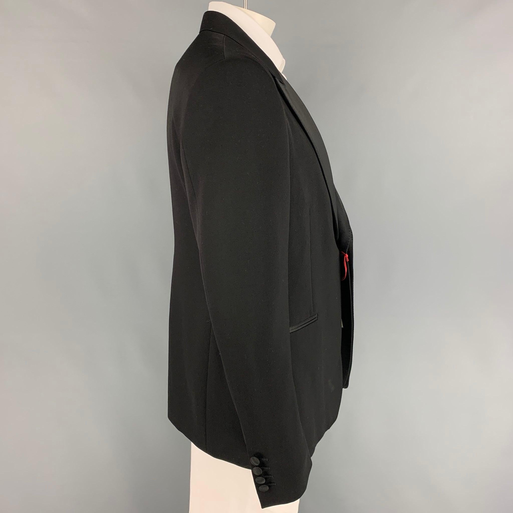 ALEXANDER McQUEEN sport coat comes in a black wool with a full liner featuring a double peak lapel, slit pockets, single back vent, and a single button closure. Made in Italy.
New With Tags. 

Marked:   56  

Measurements: 
 
Shoulder: 19 inches 