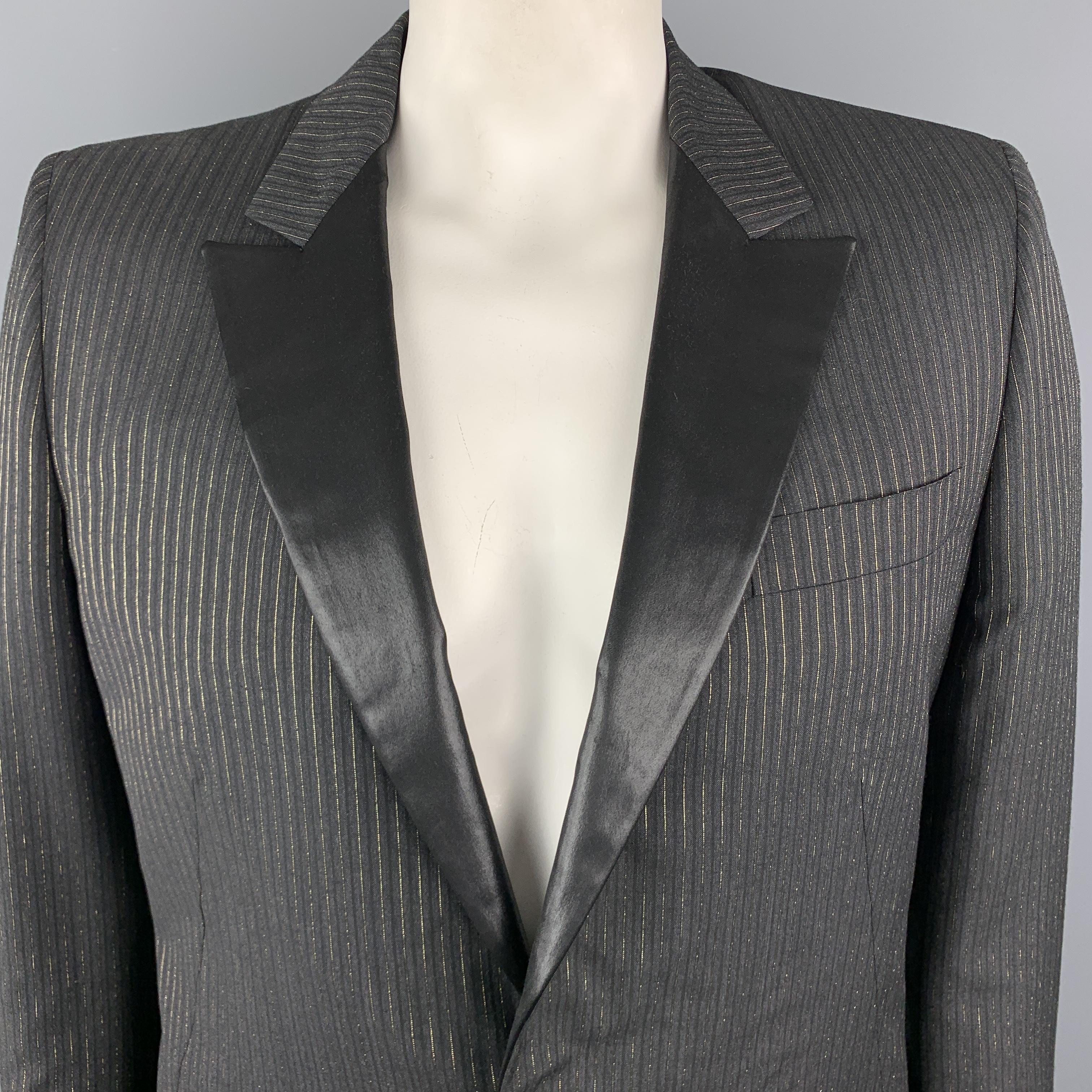 ALEXANDER MCQUEEN sport coat comes in charcoal wool blend fabric with black and gold foil stripes and features a shiny coated peak lapel, single breasted, one button front, and slanted pockets. Made in Italy.

Excellent Pre-Owned Condition. 
Marked:
