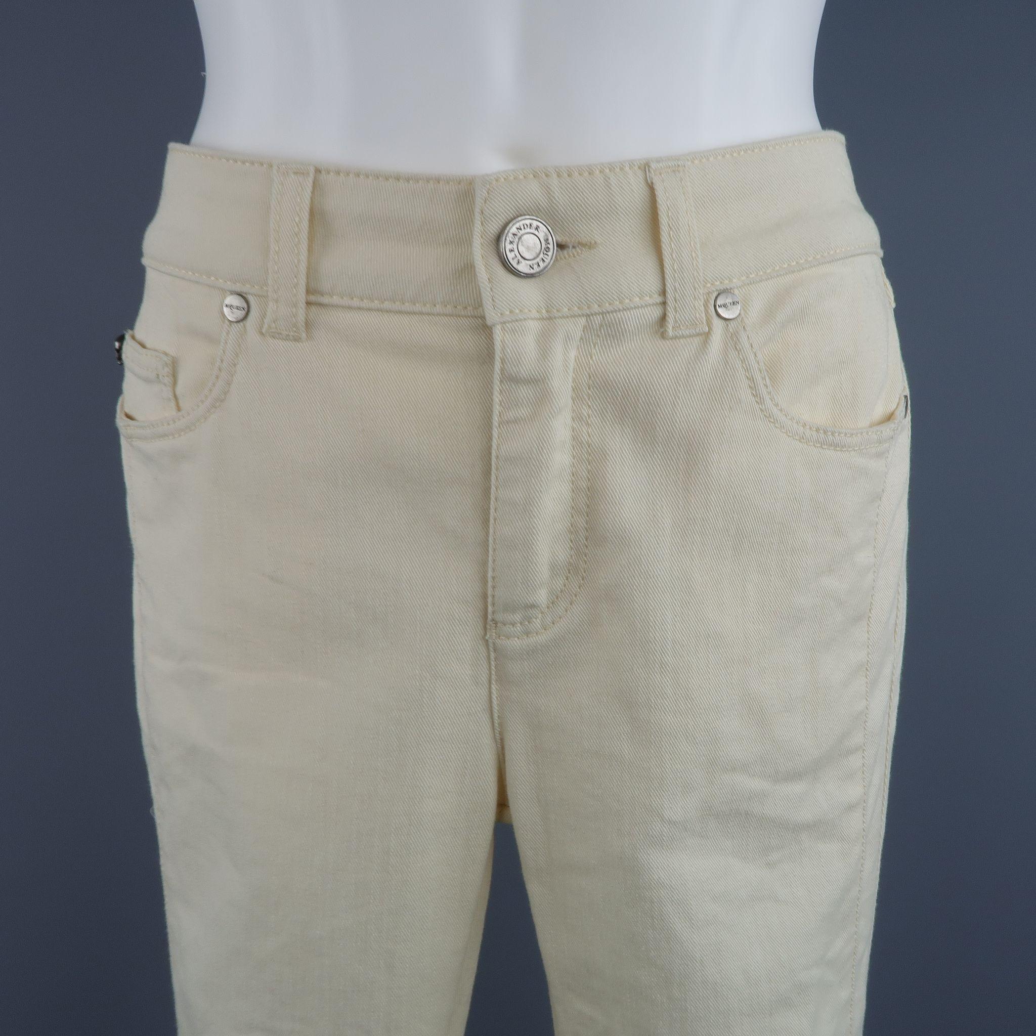 ALEXANDER MCQUEEN skinny jeans come in a creamy beige stretch denim twill and feature a thick side stripe and dark silver tone engraved skull hardware. Made in Italy.

Excellent Pre-Owned Condition.
Marked: EU 40

Measurements:

 Waist: 29 in.
 Hip: