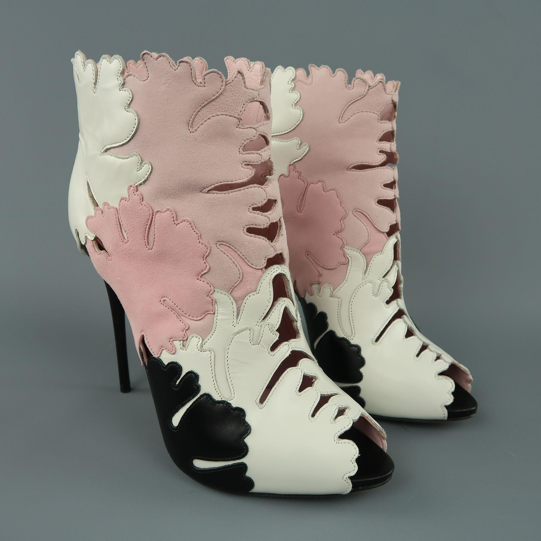 ALEXANDER MCQUEEN booties come in patch work leaf cutouts in pink, white, and black suede and leather with a peep toe, low concealed platform, and skinny stiletto heel. Worn once. Made in Italy.

Excellent Pre-Owned Condition.
Marked: IT