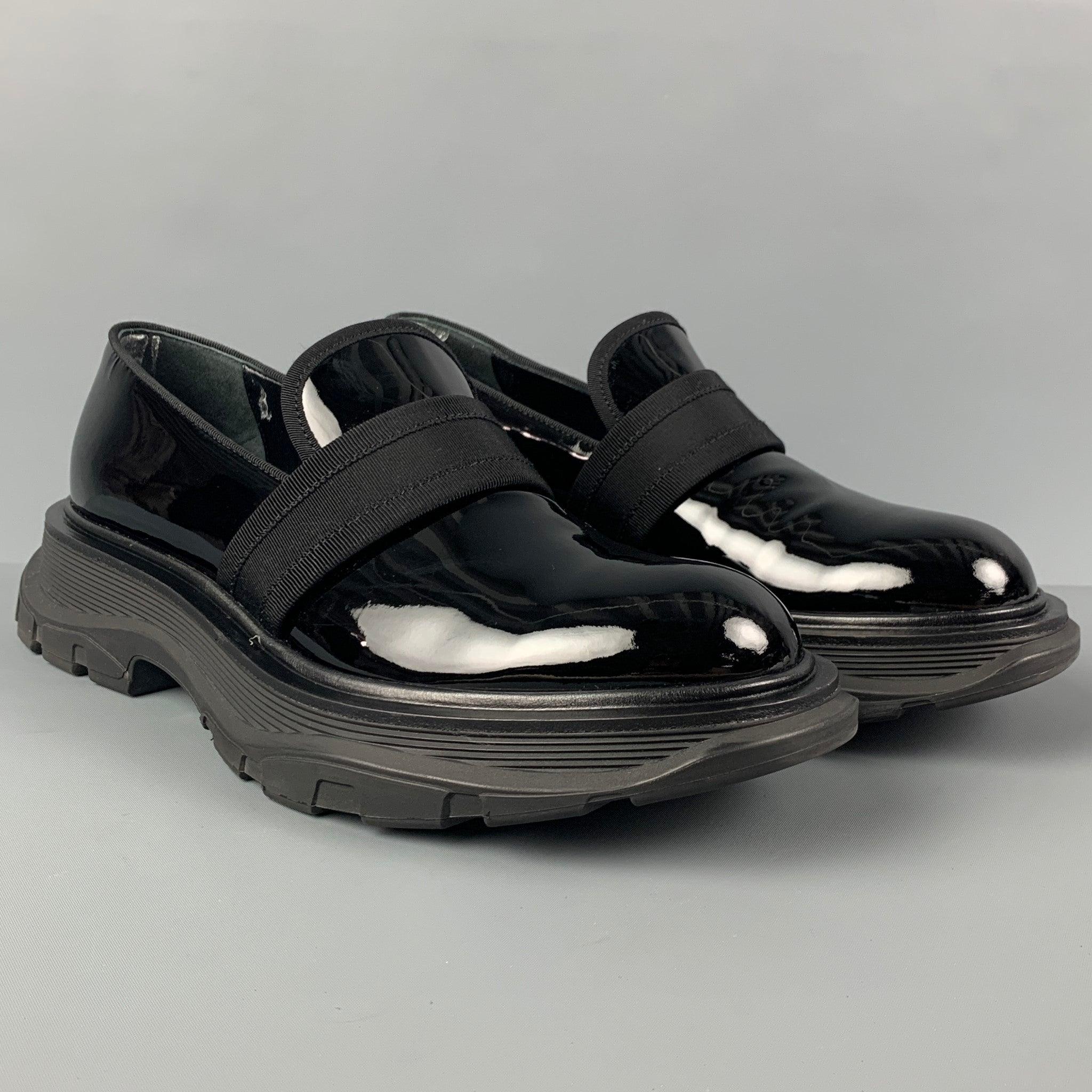 ALEXANDER McQUEEN loafers comes in a black patent leather featuring a ribbon strap detail, slip on, and a chunky sole. Made in Italy. Includes dust bag.
 Excellent
 Pre-Owned Condition. 
 

 Marked:  D 552086 42Outsole: 13.25 inches x 5.5 inches 
 