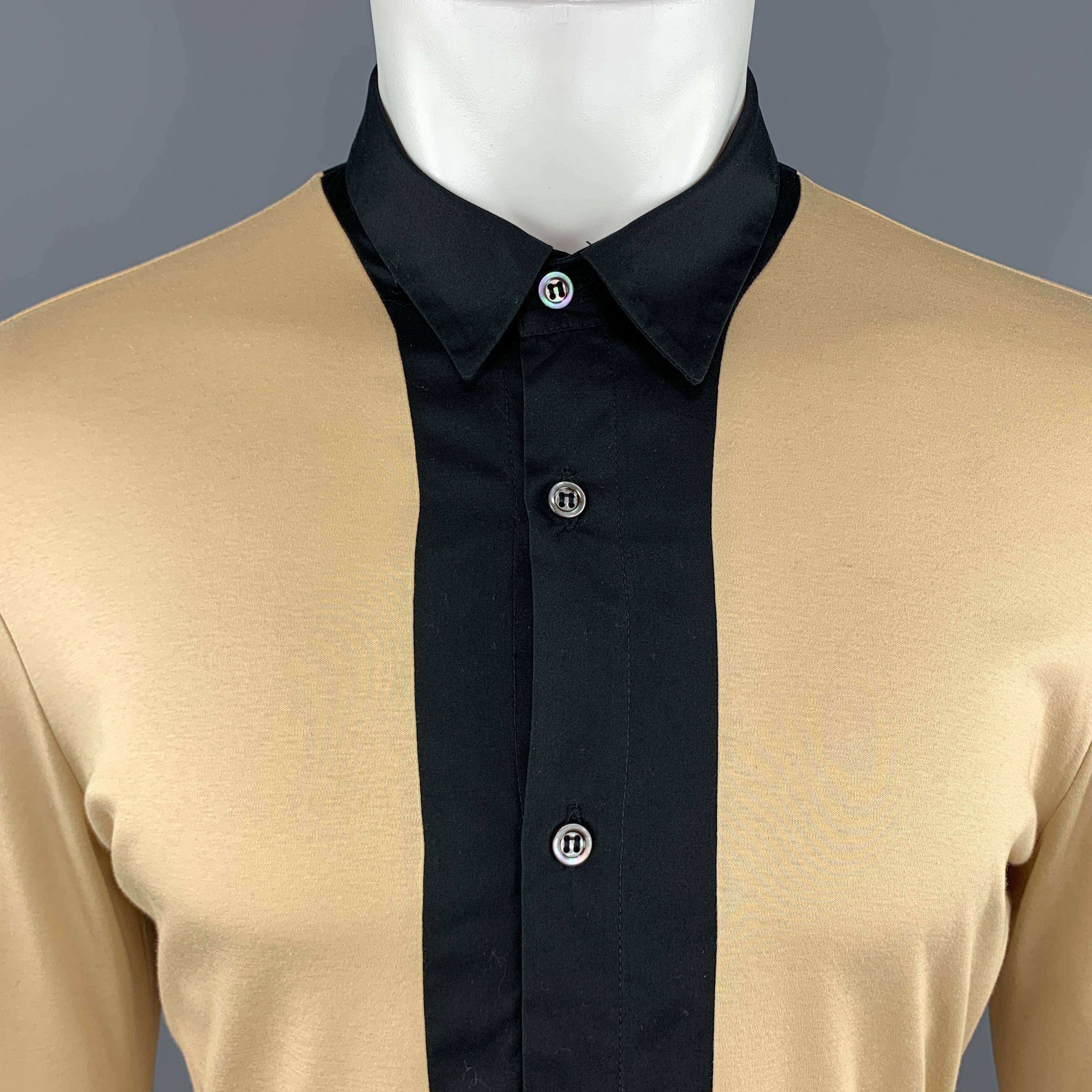 ALEXANDER MCQUEEN shirt comes in khaki beige cotton jersey with a black collared center panel and ribbed cuffs. Made in Italy.

Excellent Pre-Owned Condition.
Marked: L

Measurements:

Shoulder: 18 in.
Chest: 42 in.
Sleeve: 27.5 in.
Length: 28.5 in.