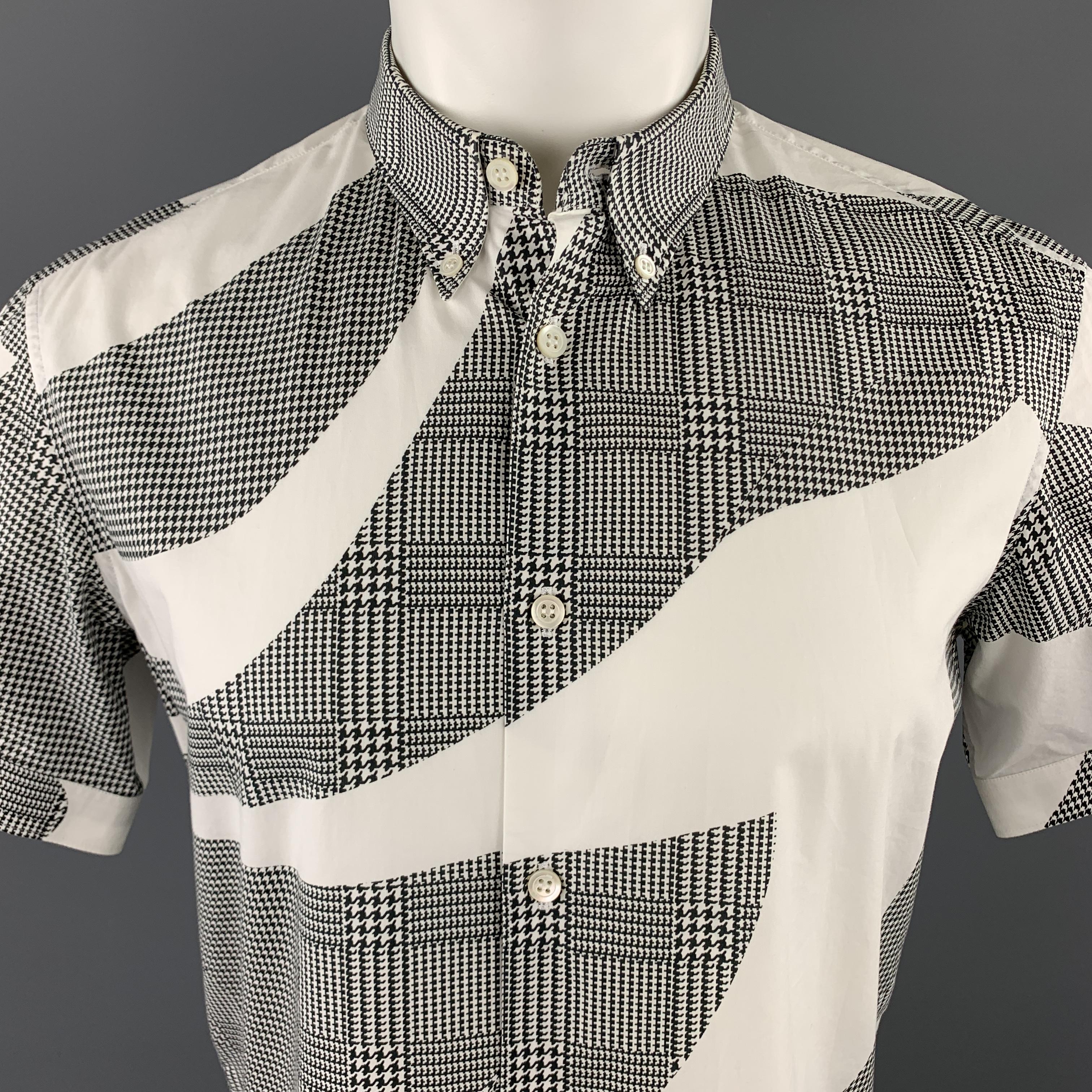 ALEXANDER MCQUEEN short sleeve shirt comes in white cotton with an all over graphic black houndstooth print and button down collar. 

Excellent Pre-Owned Condition.
Marked: IT 48

Measurements:

Shoulder: 17 in.
Chest: 42 in.
Sleeve: 8.5 in.
Length: