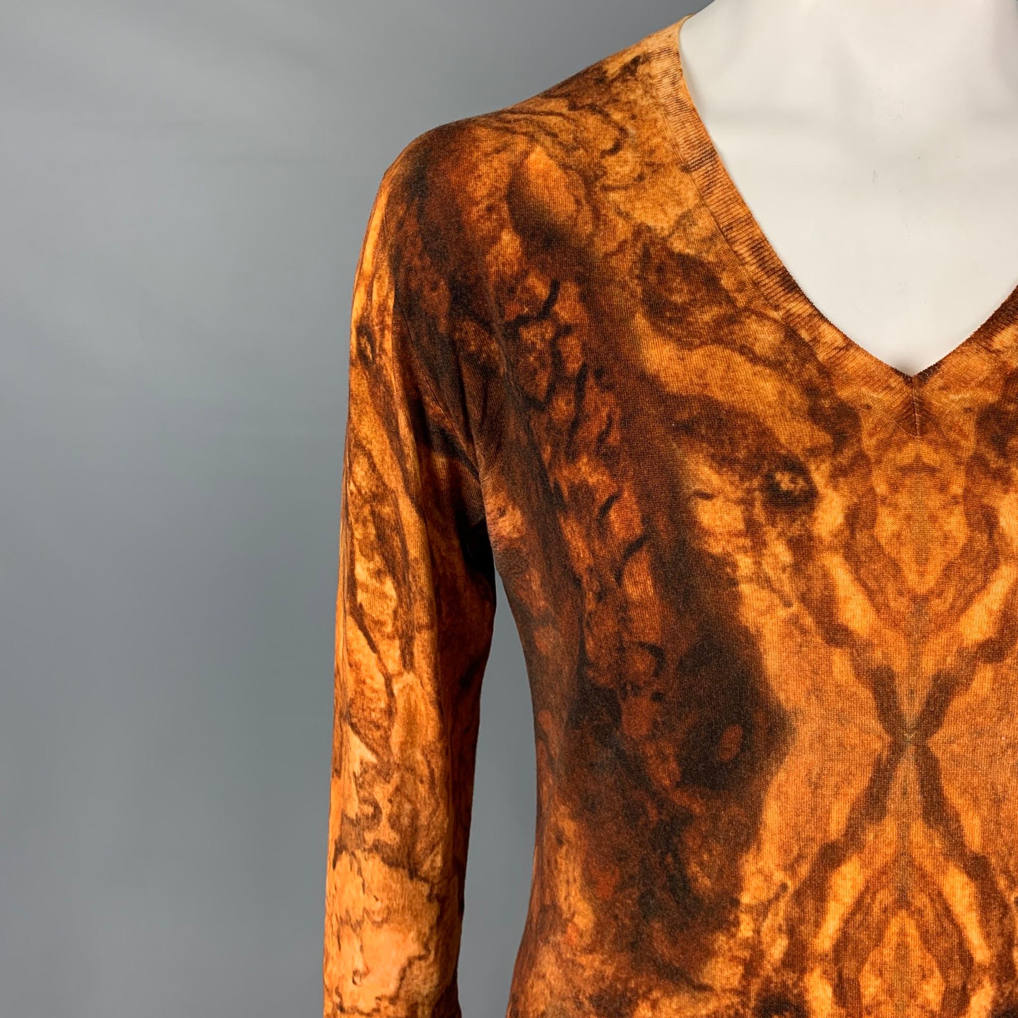 ALEXANDER McQUEEN pullover comes in a yellow & brown print wool featuring a loose fit, ribbed hem, and a v-neck. 

Good Pre-Owned Condition. Light discoloration at under arms. As-is.
Marked:  Size tag removed.

Measurements:

Shoulder: 20 in.
Chest: