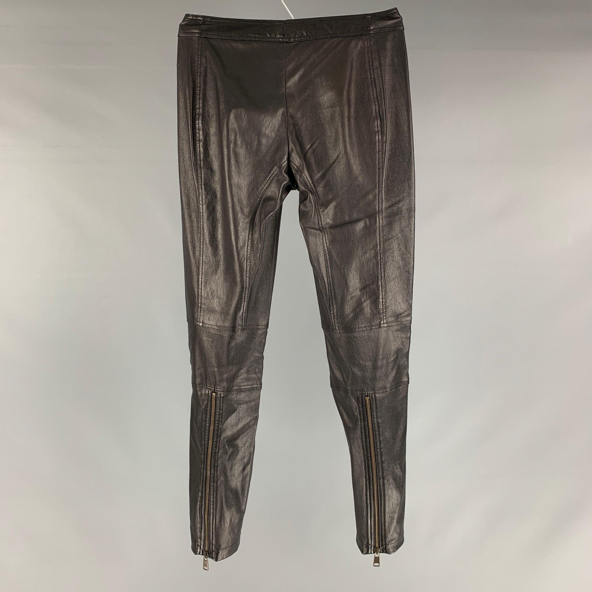 ALEXANDER MCQUEEN pants comes in a black leather material featuring cropped style, low waist, skinny fit, zipper pockets, and a zip fly closure. Please check measurements. Made in Italy.Excellent Pre-Owned Condition. 

Marked:   no size marked