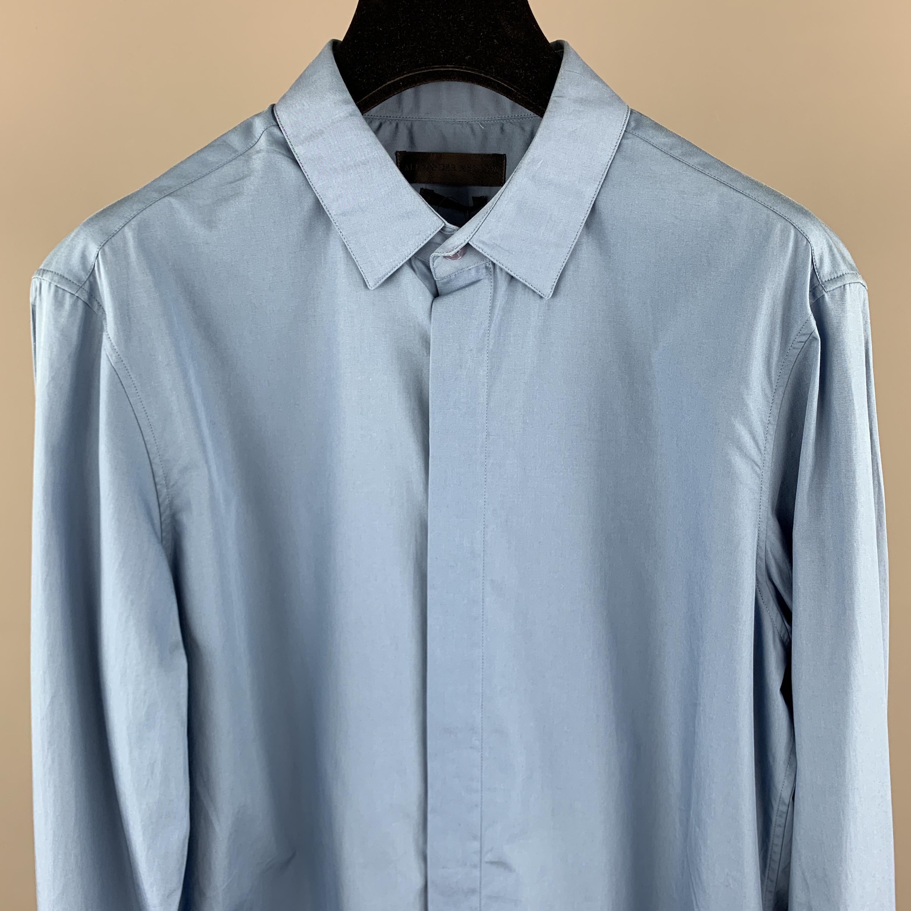 ALEXANDER MCQUEEN Long Sleeve Shirt comes in a blue cotton featuring a button up style with a hidden button closure. Made in Italy.

New With Tags. 
Marked: 46

Measurements:

Shoulder: 15.5 in. 
Chest: 36 in.
Sleeve: 27 in. 
Length: 32 in. 