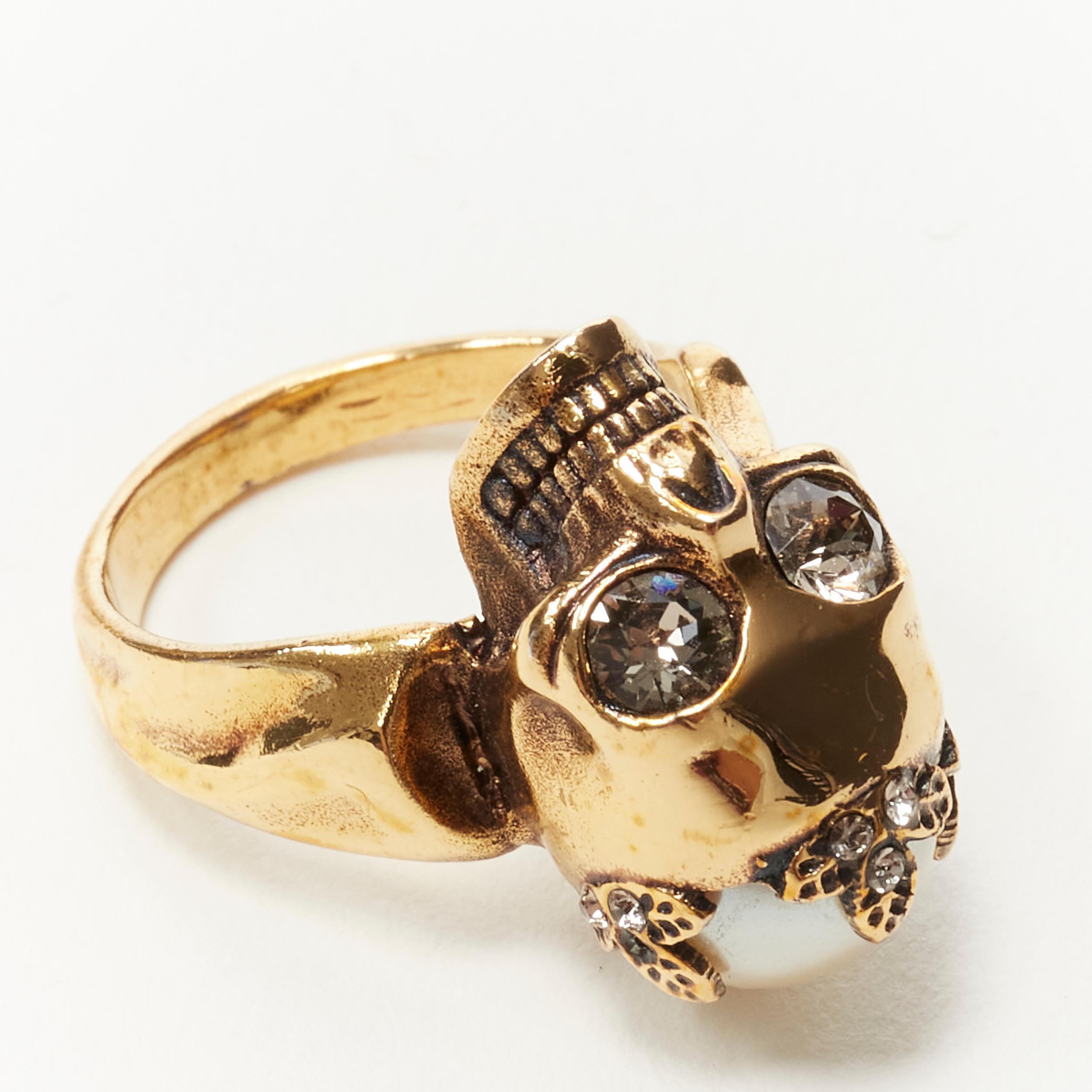 ALEXANDER MCQUEEN Skull crystal eyes pearl crown gold metal ring 
Reference: KEDG/A00022 
Brand: Alexander McQueen 
Designer: Sarah Burton 
Material: Metal 
Color: Gold 
Pattern: Solid 
Extra Detail: Gold-tone brass. Crystal embellished and pearl