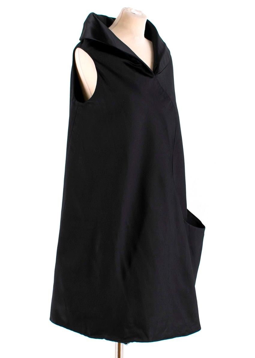 Alexander McQueen Sleeveless Black Satin Dress

-Black satin dress
-High collar
-Sleeveless
-One front pocket
-Shift dress

Please note, these items are pre-owned and may show signs of being stored even when unworn and unused. This is reflected