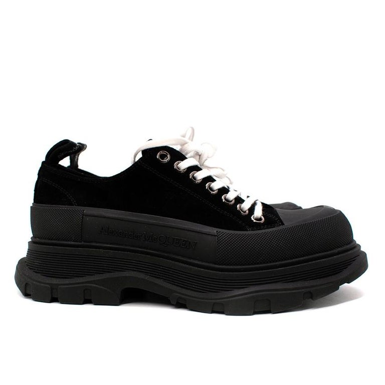 Alexander McQueen Slick Black Suede Platform Sneakers
 

 - Heavy duty platform rubber sole, suede upper and lace-up front in contrasting white 
 - Logo heel pull 
 

 Materials 
 25% Polyamide 
 25% Rubber
 Lining
 25% Polyamide 
 25% Rubber 
 

