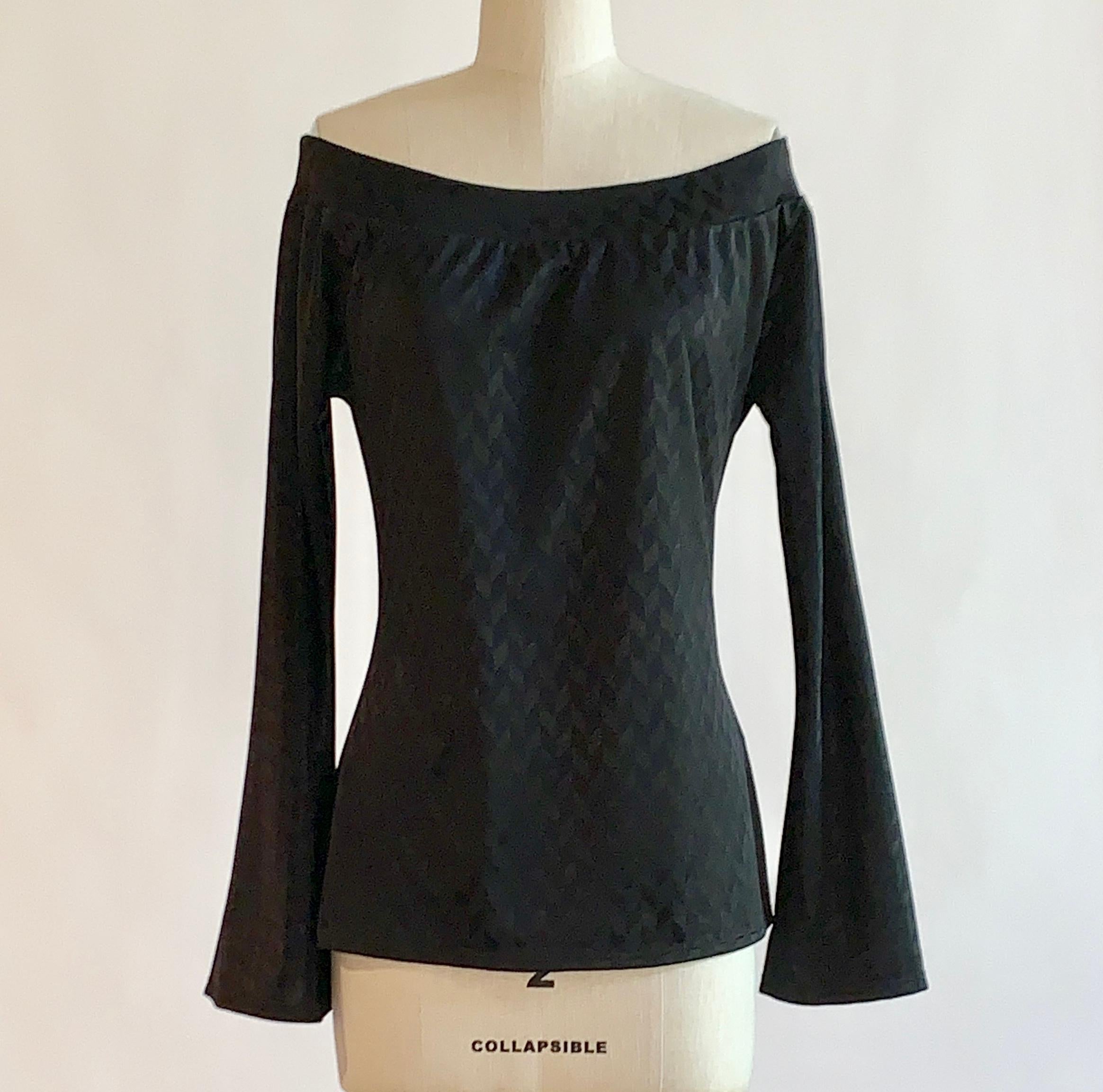 Alexander McQueen black chevron pattern off the shoulder long sleeve top with long bell sleeves. No closure, pulls on.

Seen on the Spring 2000 runway in red, look 56.

100% polyethylene. 

Made in Italy.

Labelled size IT 46, usually US 10, but