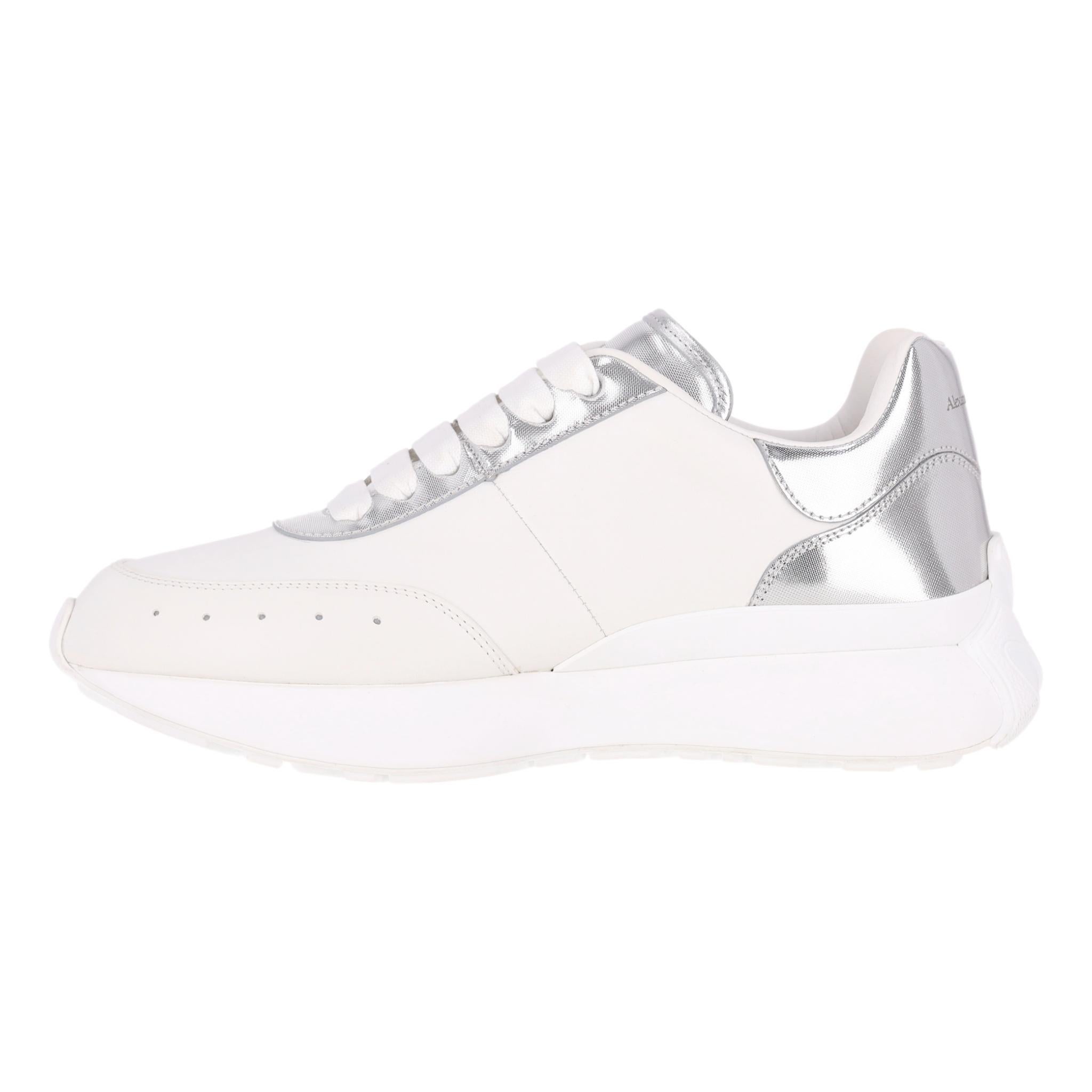 Alexander McQueen Sprint Runner Leather Sneakers With Metallic Panels

White leather sneakers designed with a slightly elongated toe, set on a chunky sole.

Featuring metallic silver leather panels and 'Alexander McQueen' signature to the tongue and