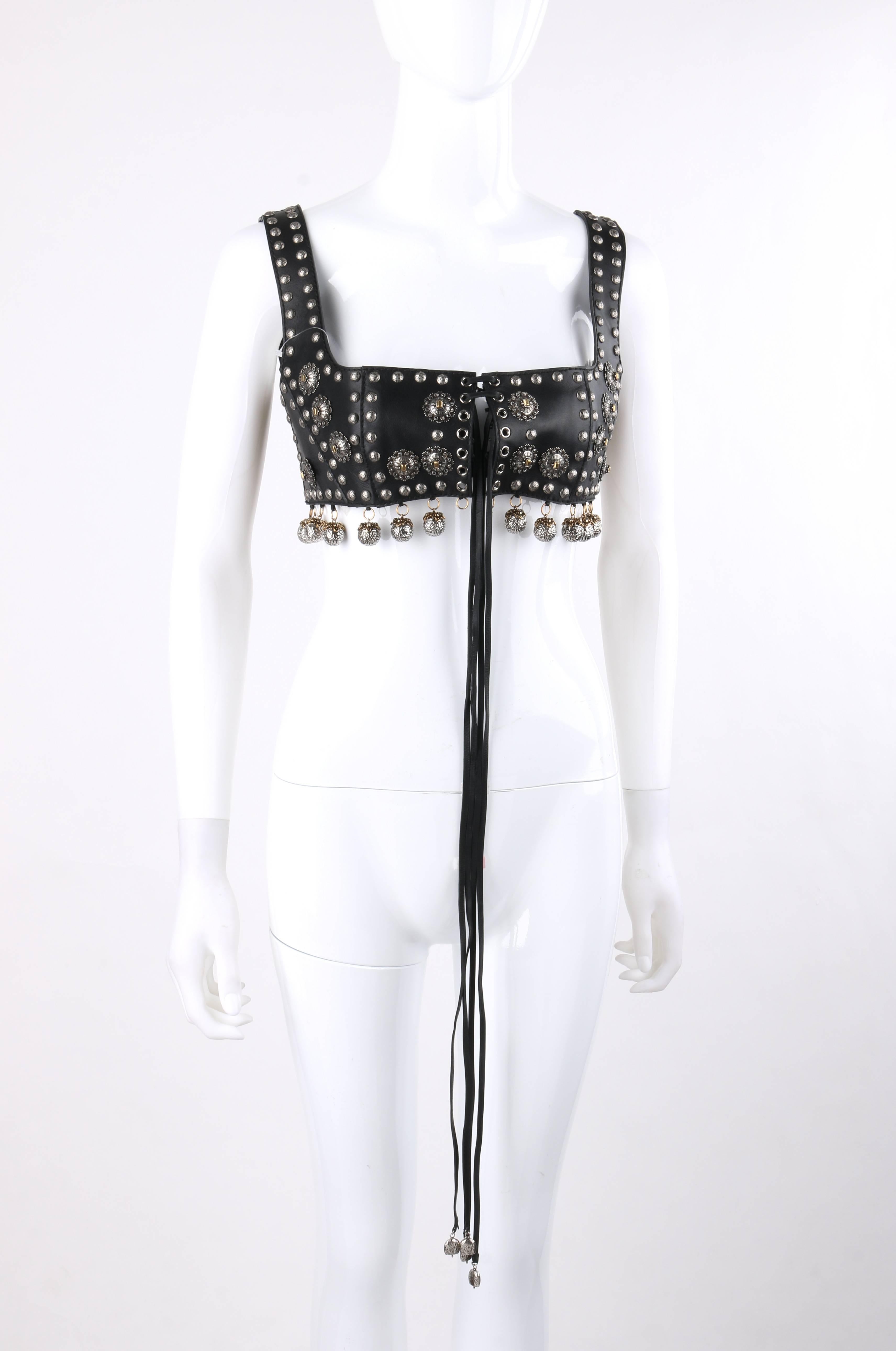 Alexander McQueen S/S 2015 black nappa leather studded lace up bra top / bustier. Runway look #17 designed by Sarah Burton. Black calfskin (nappa) leather bra top. Square neckline. Sleeveless. Princess seams. Center front lace up detail. Two thin
