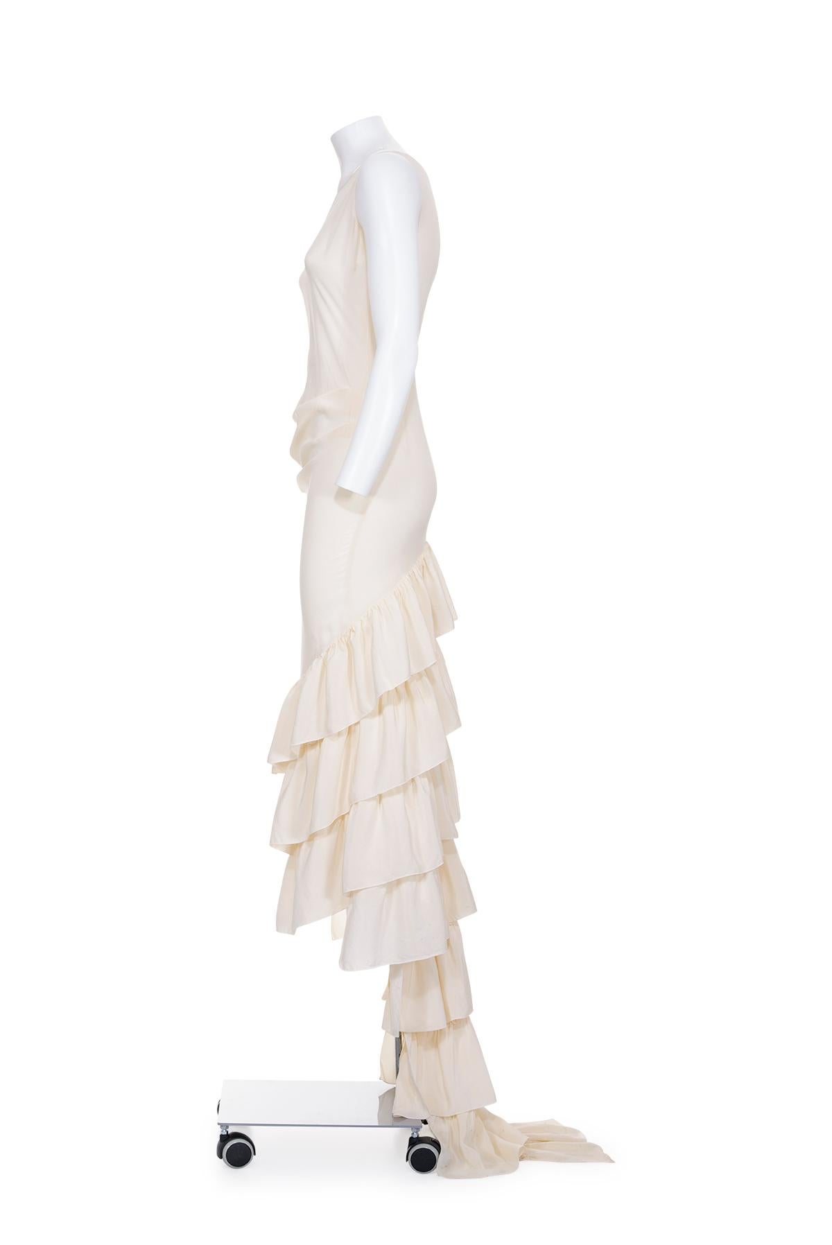 Spring Summer 1999 rare silk dress with drape at waist from “n.13” collection by Alexander McQueen.
Ruffle train.
The composition is 100% silk.