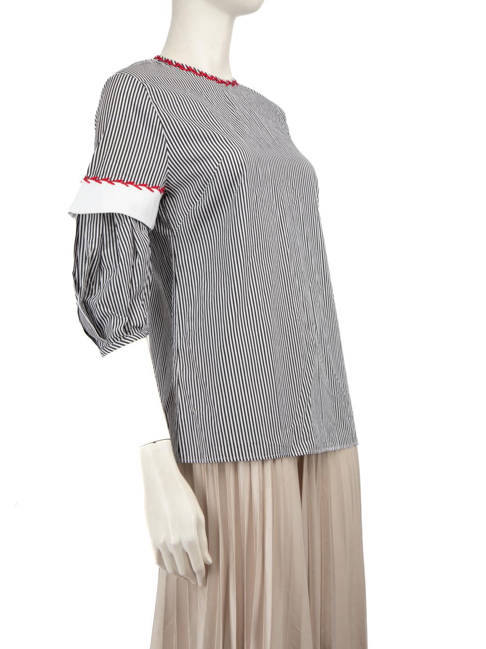 CONDITION is Never worn, with tags. Due to poor storage of the top, there is a small tear to the fabric on the hem of the right sleeve. The loop to secure the top back neckline button has become loose on this new Alexander McQueen designer resale