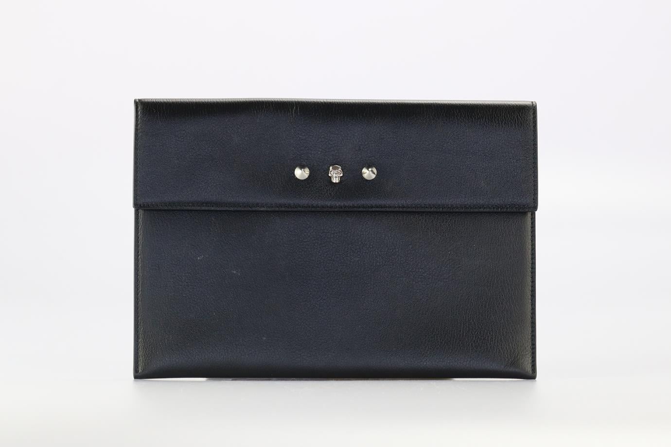 Alexander Mcqueen Studded Leather Clutch. Black. Snap button fastening - Front. Comes with - dustbag. Height: 7.7 in. Width: 11.1 in. Depth: 0.2 in. Condition: Used. Very good condition - Light scuff marks and marks to exterior material. Some light