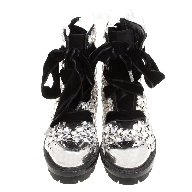 Chic, stylish and very modern, these Biker boots from Alexander McQueen will add sparks of luxury to your wardrobe! The black boots are crafted from suede and feature silver-tone hardware detailed cap toes, exquisite crystals embellished all over