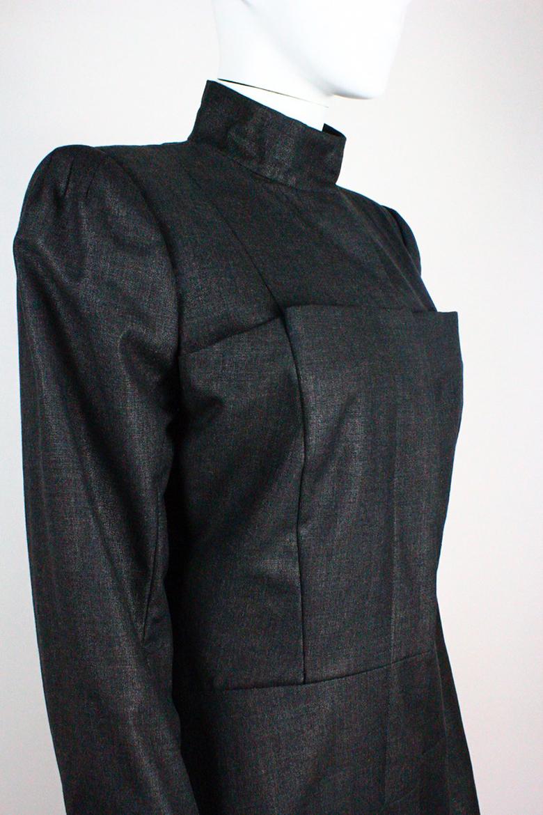Alexander McQueen dark grey wool coat, from the Fall/Winter 1999 'The Overlook' collection. Very interesting tailoring and details, featuring large pockets on the front.

Condition
Excellent

Marked Size
IT 46

Approximate Measurements

Bust: