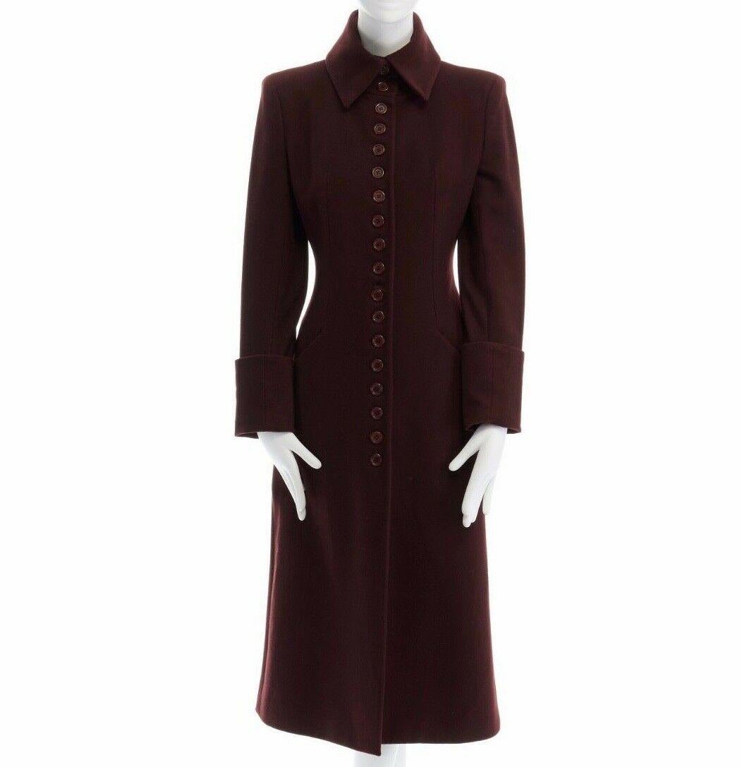 ALEXANDER MCQUEEN VINTAGE
FROM THE FALL WINTER 1998 'JOAN' COLLECTION
BURGUNGY BLOOD RED • OVERSIZED COLLAR • BUTTON FRONT CLOSURE • SLANTED POCKETS AT FRONT • CUFFED SLEEVES • STRONG PADDED SHOULDERS • SINGLE BACK VENT • FULLY LINED IN BLACK