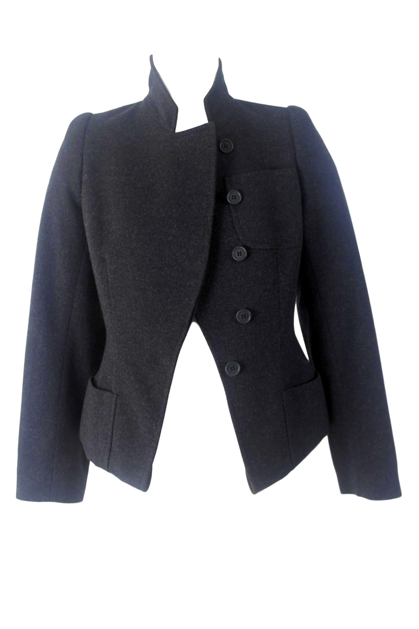 Alexander McQueen 
Wool and Cashmere Jacket
Labelled Size 40
Jacket has deep hem creating a peplum
This is intentional and can be viewed on runway