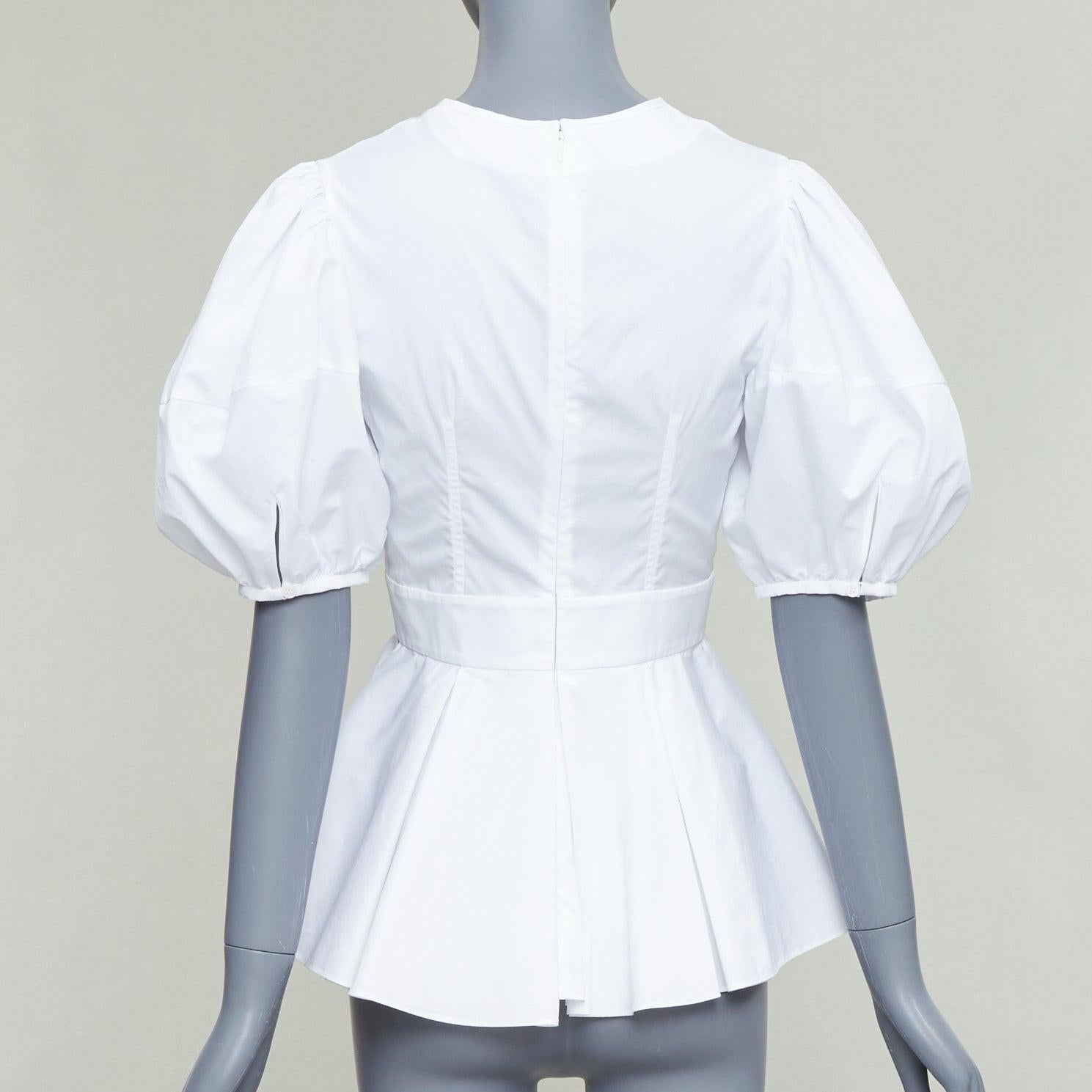 De las mujeres ALEXANDER MCQUEEN top peplum de algodón blanco con mangas abullonadas y pliegues delanteros IT38 XS en venta