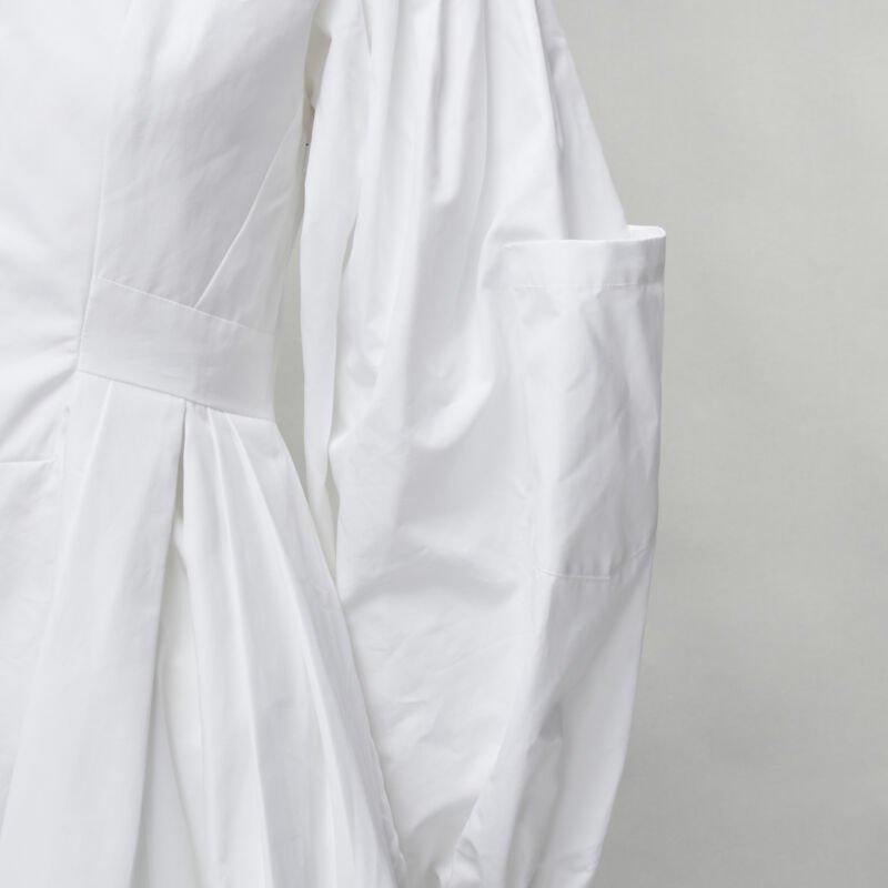 ALEXANDER MCQUEEN white cotton silver zip front puff sleeve flared dress IT36 XS
Reference: AAWC/A00018
Brand: Alexander McQueen
Material: Cotton
Color: White
Pattern: Solid
Closure: Half Zip
Lining:  Unlined
Extra Details: Exposed silver-tone zip