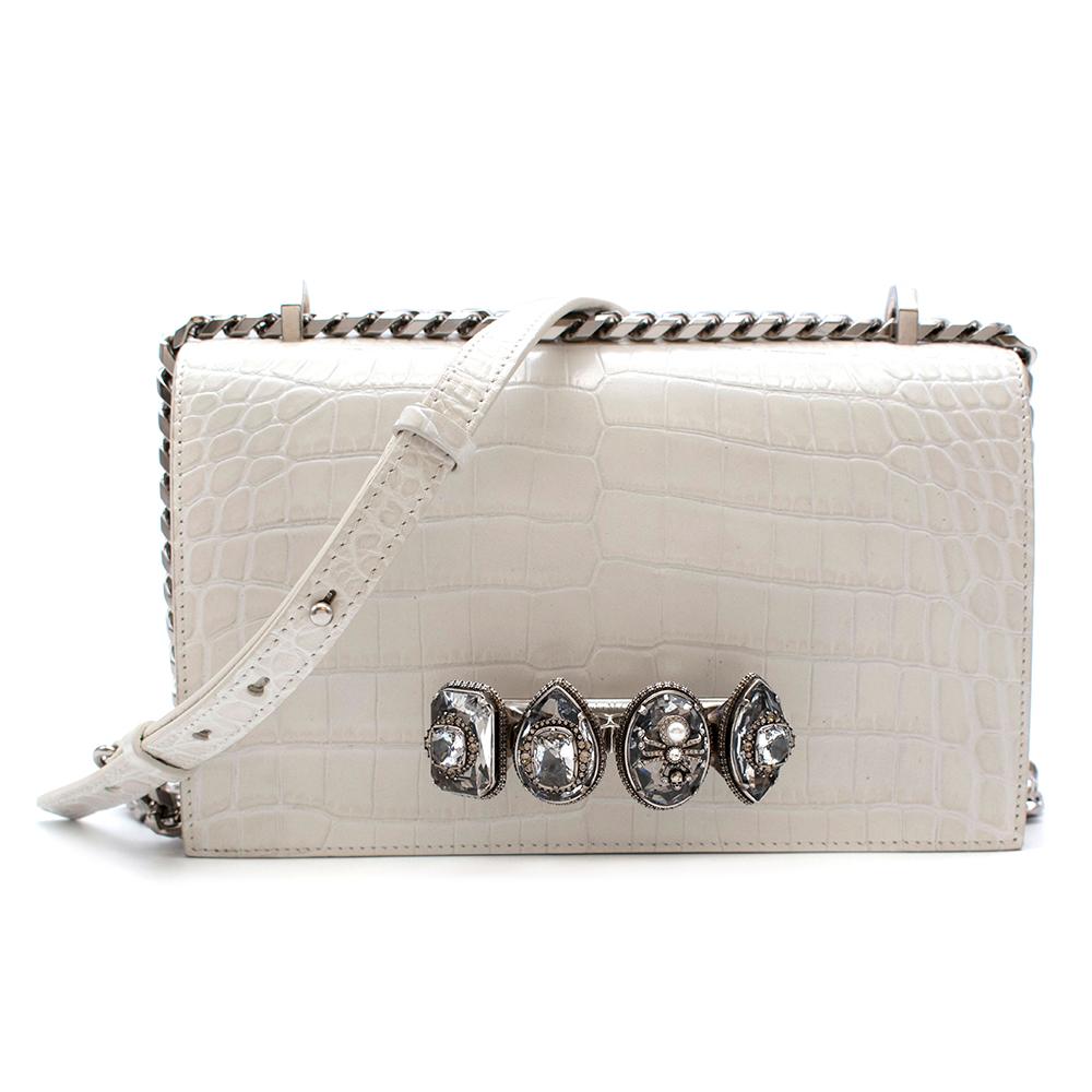 Alexander McQueen White Knuckle Crocodile Cross Body Bag

- From AW18 Collection
- Crafted from crocodile-effect leather
- Silver-tone metal knuckle clasp
- Faux-pearl and crystal-embellished creatures
- Leather and silver-tone cross-body chain
-