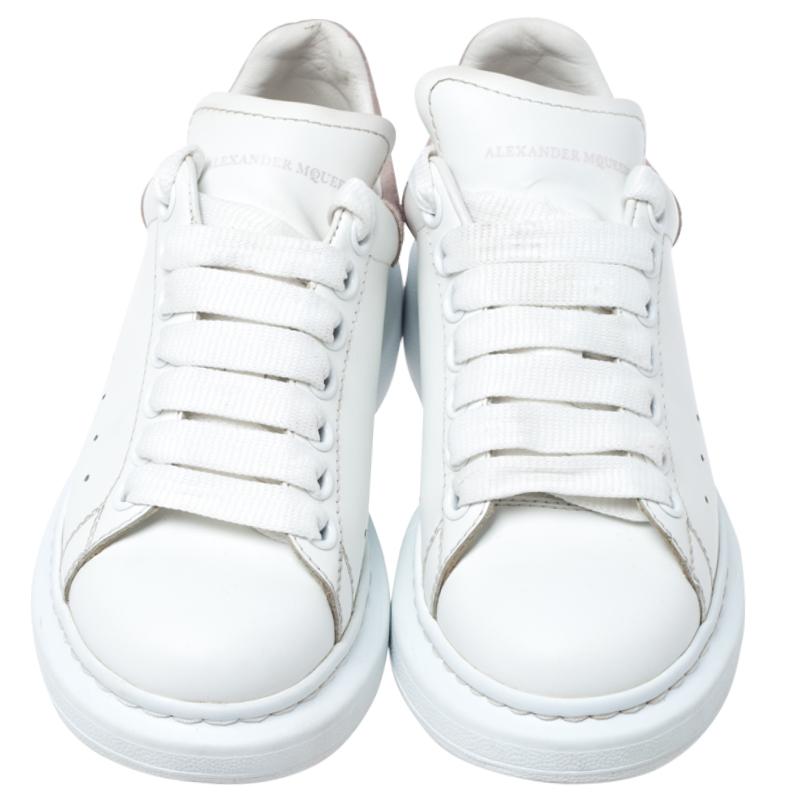 These sneakers from Alexander McQueen are so chic, you'll love wearing them for your fun outings with friends! The white sneakers are crafted from leather and feature round toes. They flaunt lace-ups on the vamps and a suede panel on the counters.