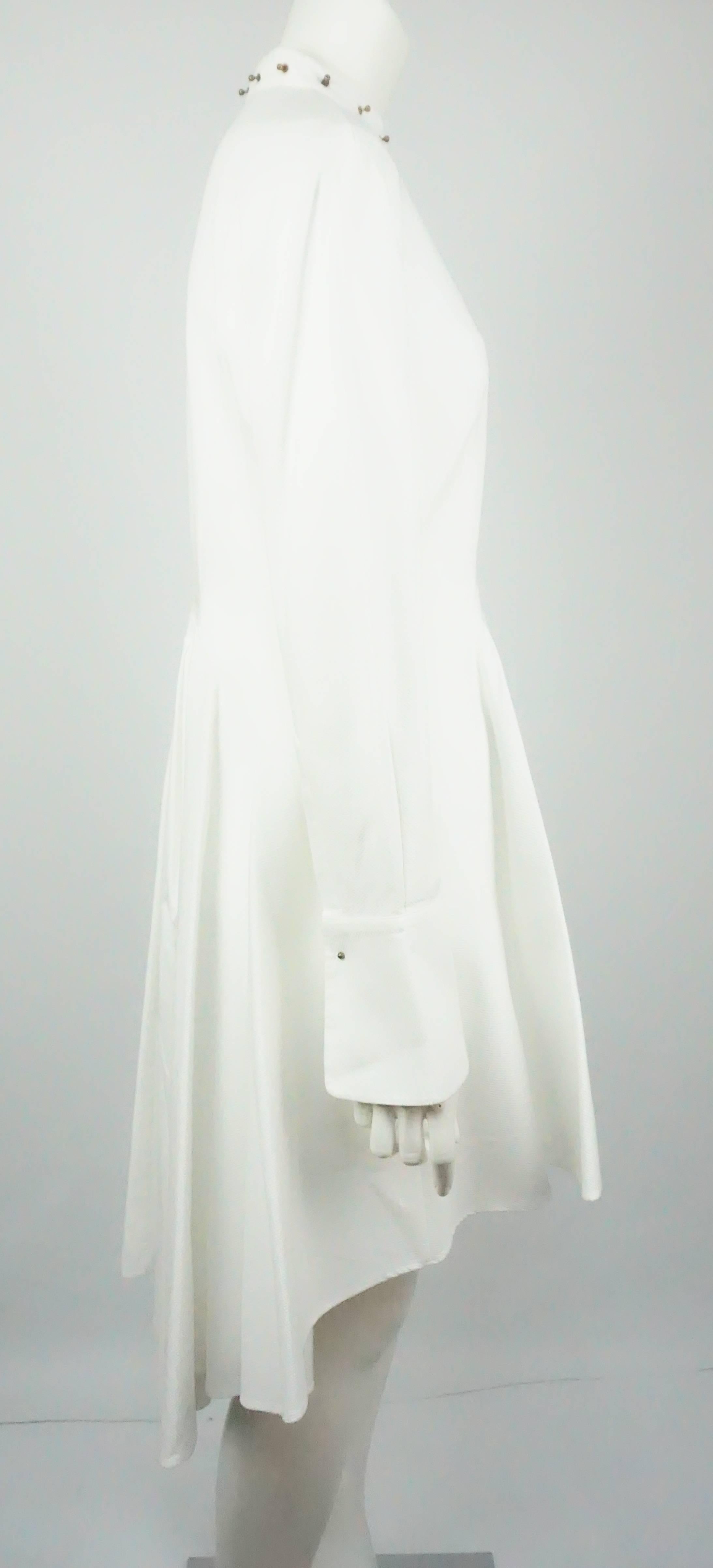 Alexander McQueen White Pique Long Tunic/3/4 Coat - M  This beautiful White Cotton Pique McQueen piece can be worn as a tunic, a 3/4 Coat or even a dress. The piece has a high low effect, has hidden buttons completely down the front, Brass looking