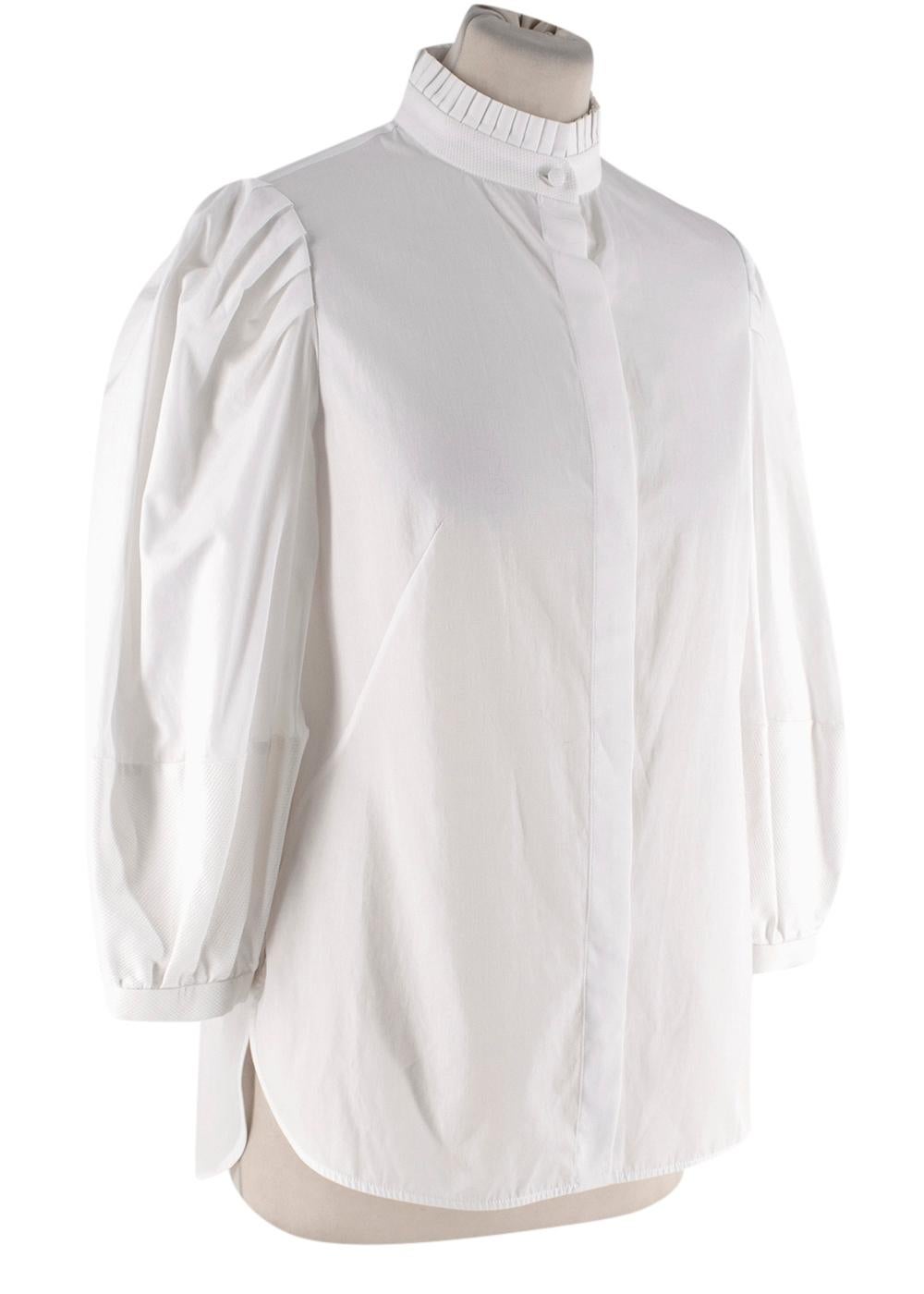 Alexander McQueen White Poplin & Waffle Cotton Shirt

- Button up white shirt crafted from poplin cotton with waffle panels to the cufffs and collar
- Pleated finished to the collar
- Balloon sleeves

Materials:
100% Cotton

Made in Italy

PLEASE