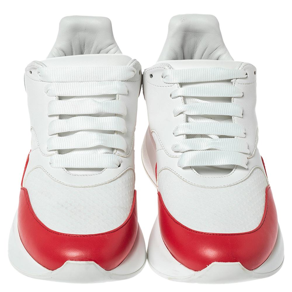 These sneakers from Alexander McQueen are truly a maker of trends. The oversized sneakers are designed in a low-top profile using white/red leather. Finished with lace-ups and high soles, this pair is filled with comfort and style, just perfect to