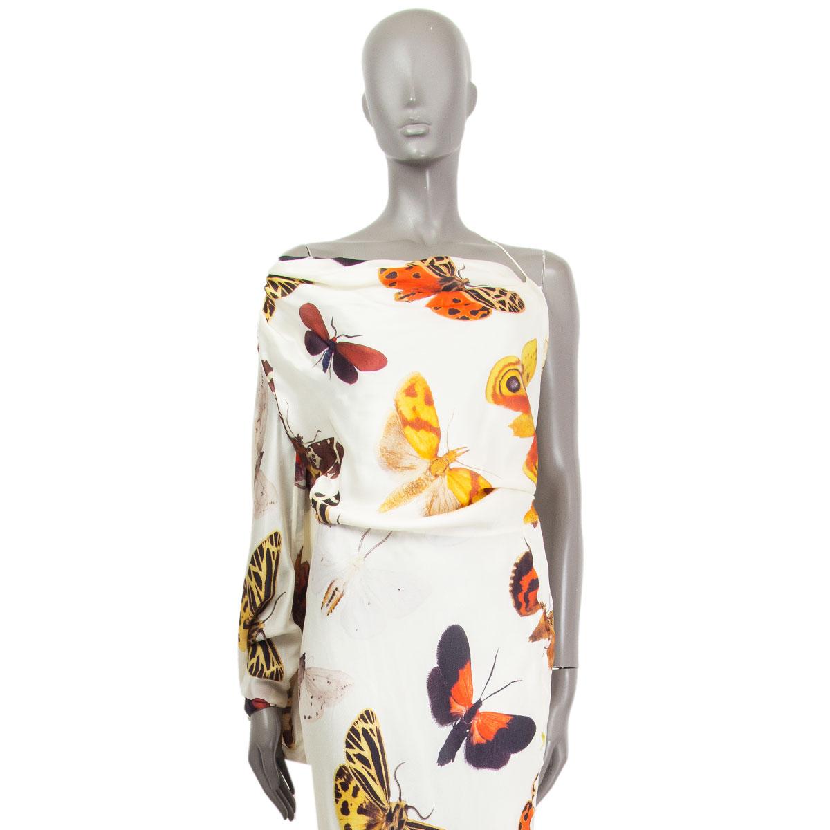 authentic Alexander McQueen satin evening gown in cream silk (100%) with one-shoulder draped bias-cut, butterfly print in multi-colors. Lined in white silk (100%). Closes with a concealed zipper on the left side. Has been worn and is in excellent