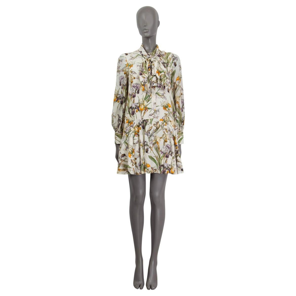 100% authentic Alexander McQueen's silk mini floral dress in off-white and multicolor silk (100%) with a flared hem, pussy-bow tie, long sleeves and buttoned cuffs. Closes with button fastening in the front. Lined in off-white silk (100%). Has a