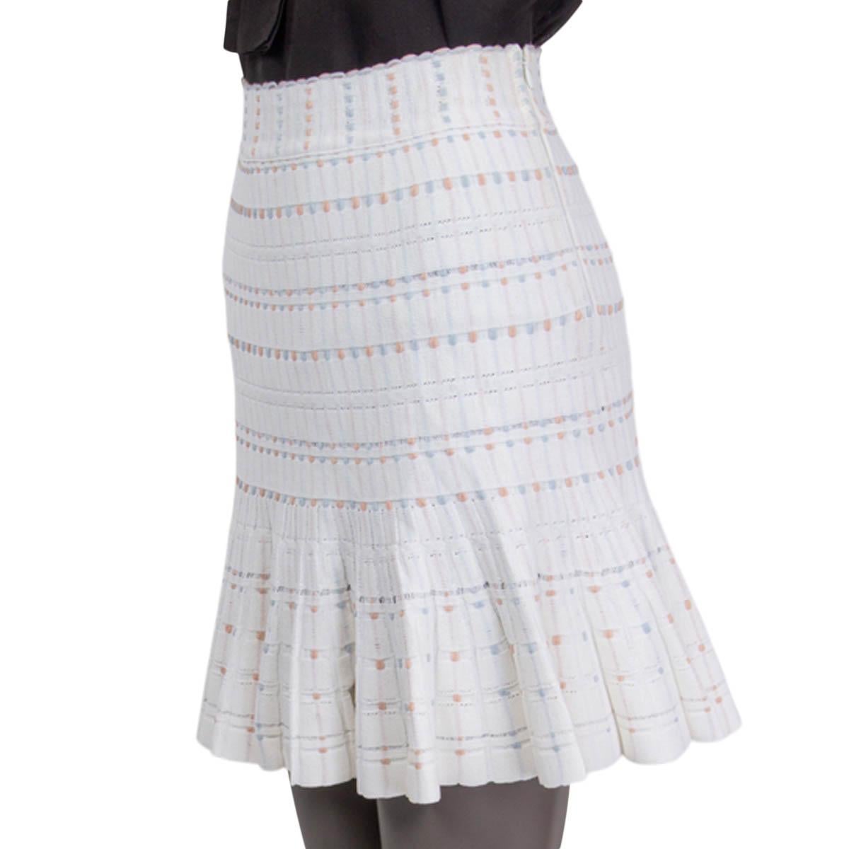 100% authentic Alexander McQueen flared ribbed knit skirt in white, baby pink and baby blue viscose (77%), polyester (15%), cotton (5%) and nylon (3%). Opens with a zipper on the side. Unlined. Has been worn and is in excellent condition. Matching