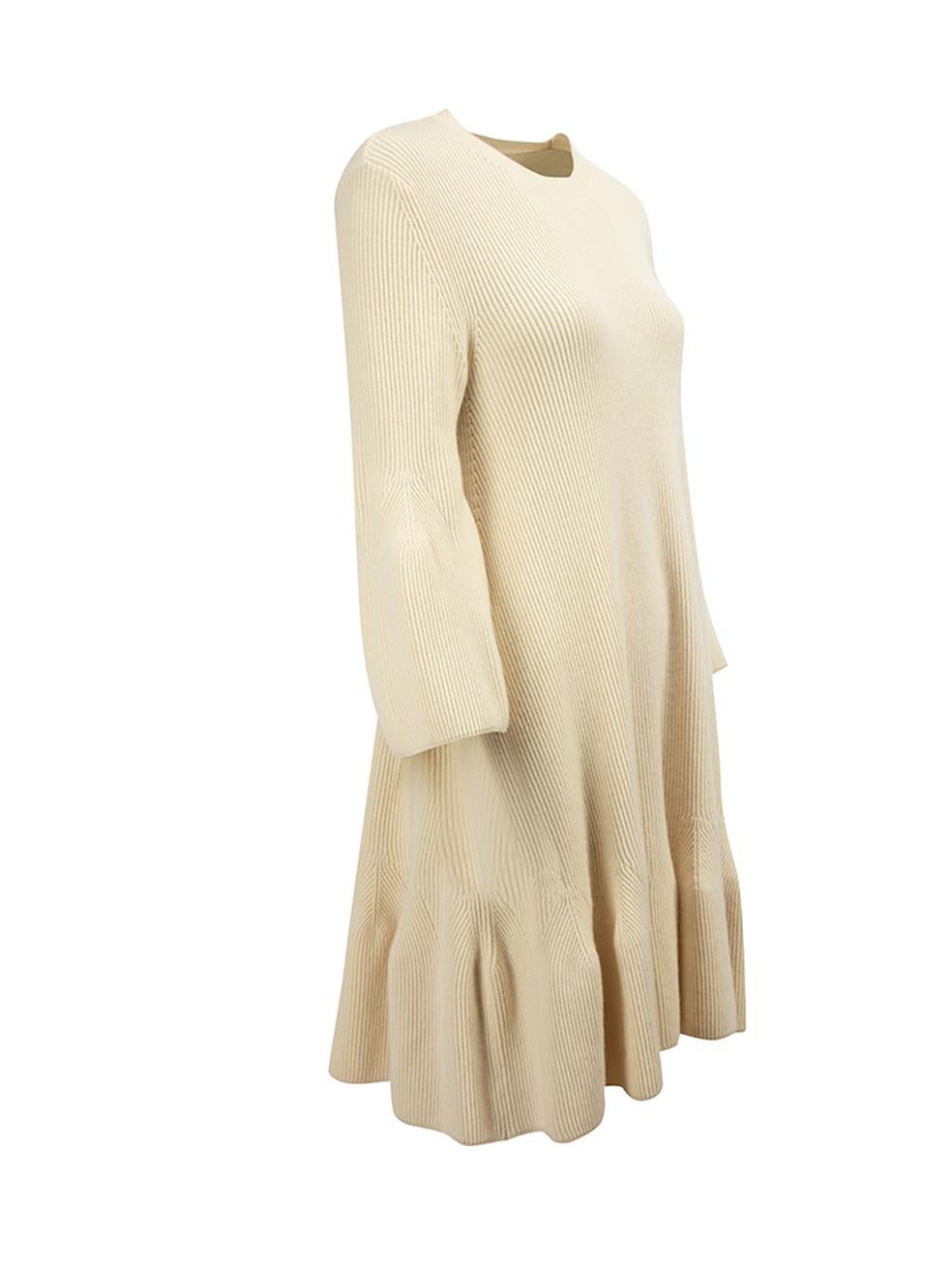 CONDITION is Very good. Minimal wear to dress is evident. Stains can be seen on the left cuff on this used Alexander McQueen designer resale item. 



Details


Cream

Wool

Mini knit sweater dress

Round neckline

Flared sleeves





Made in