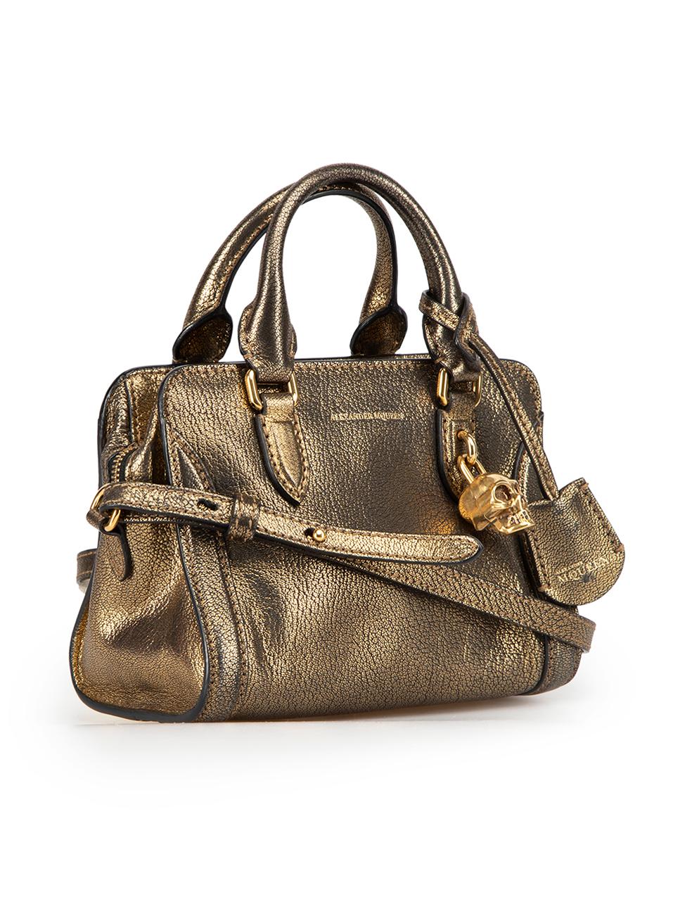 CONDITION is Very good. Minimal wear to bag is evident. Minimal wear to the base and corners with very light scuffing on this used Alexander McQueen designer resale item.



Details


Gold

Leather

Mini bag

2x Rolled top handles

1x Adjustable and