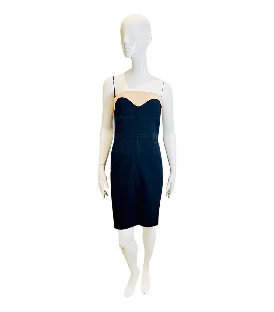 Alexander McQueen Wool Blend Bandeau Dress

Black, fitted dress designed with ivory trimmed neckline.

Featuring white, contract stitching detailing, front slit and concealed zip closure to rear.

Size – 40IT

Condition – Very Good

Composition –