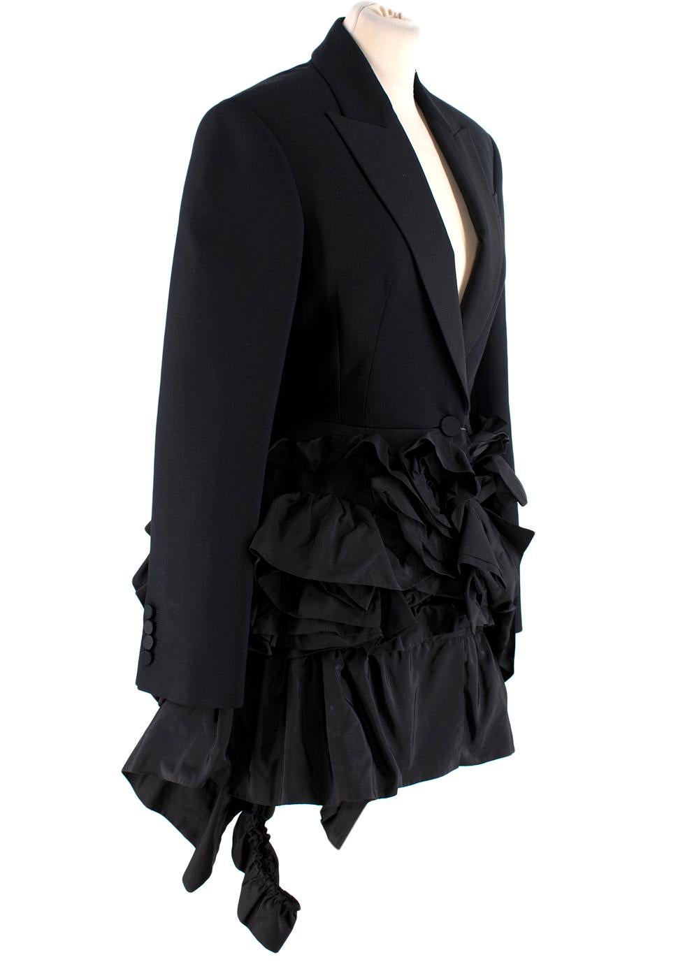 Alexander McQueen Wool-Silk Blazer with Silk Faille Ruffles
 

 - Elegant single-breasted wool-silk blazer jacket with a single button, decorated with voluminous silk faille ruffles across the hip and back
 - Fully lined
 

 Materials 
 63% Wool
