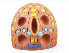 "Testa colorata perforata"