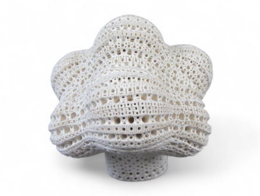 Original signed terracotta sculpture by Alexander Ney (Russian-American, 1939-2023) featuring his signature perforated surface texture and abstract stylized head form. The piece showcases Ney's characteristic biomorphic design, with rhythmic